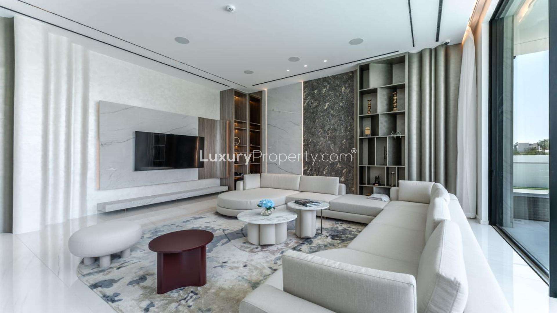 Modern dining room with elegant decor in Dubai Hills Estate villa, featuring large glass doors