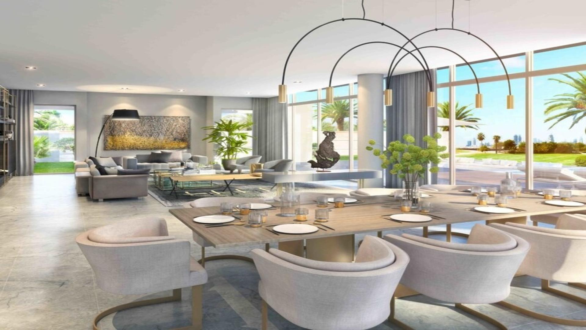 Modern corner villa with pool, palm trees, and large windows in Dubai Hills Estate