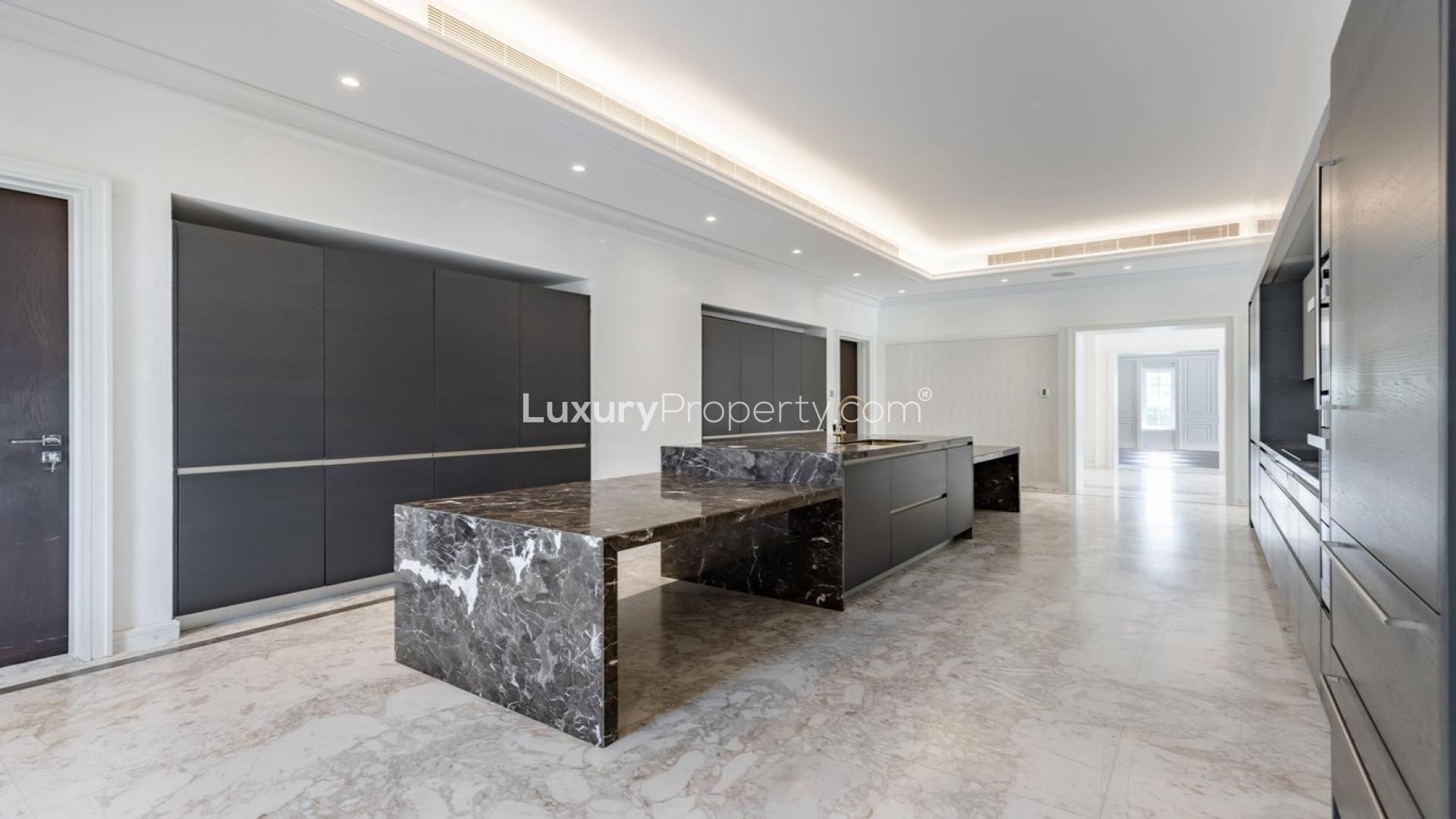 Luxurious empty living area with wood flooring in Polo Homes villa, Arabian Ranches