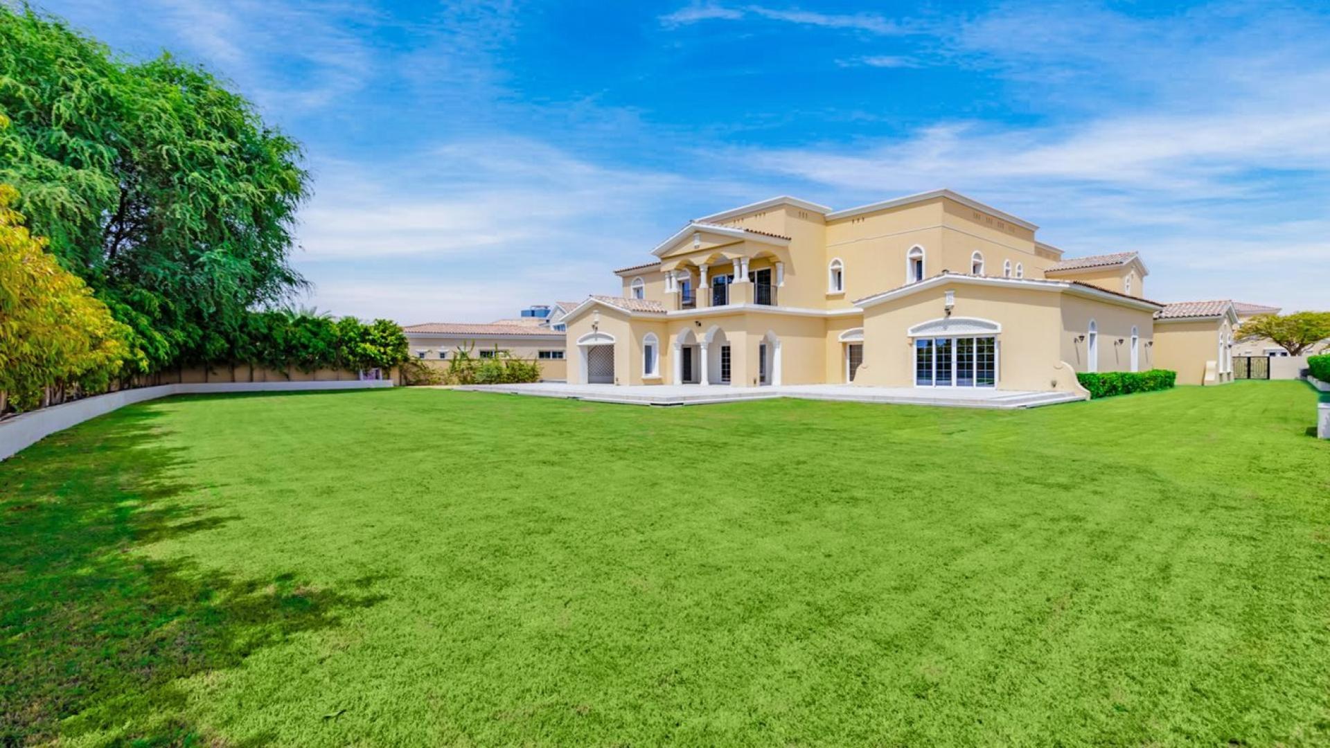 Elegant living room with wooden flooring in 6-bedroom Polo Homes villa, Arabian Ranches