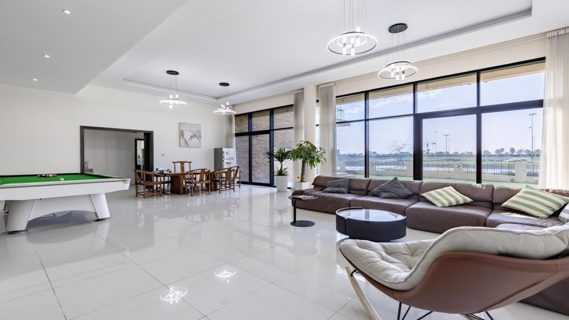 Luxurious 6-bed villa exterior with patio in Silver Springs, Damac Hills, for sale