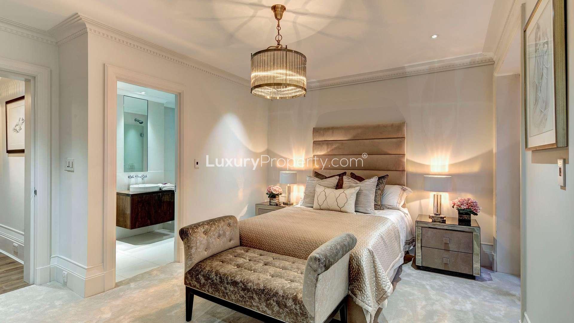 Elegant dining room in luxury 6-bedroom Kensington apartment, featuring modern decor and lighting