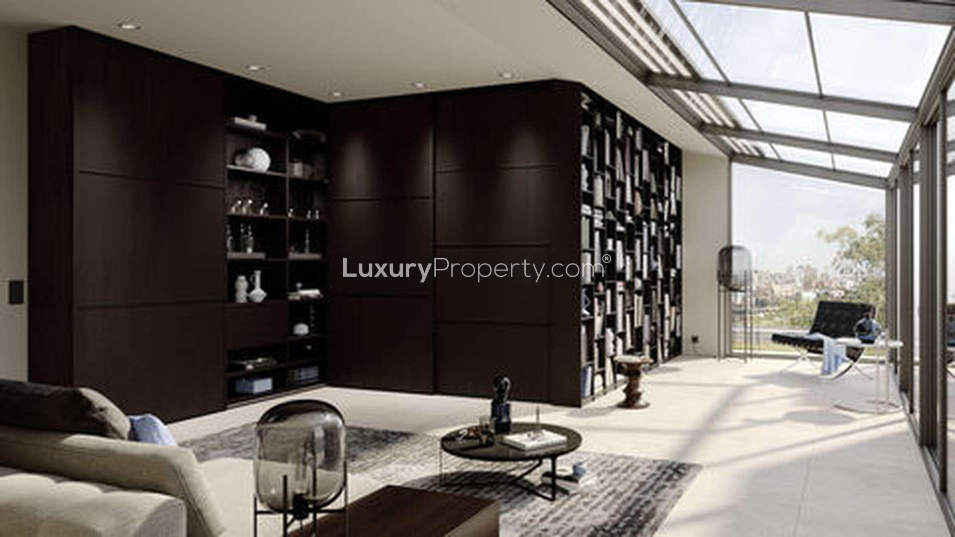 Modern duplex apartment exterior at The Residences, Lagos, surrounded by lush greenery and cars