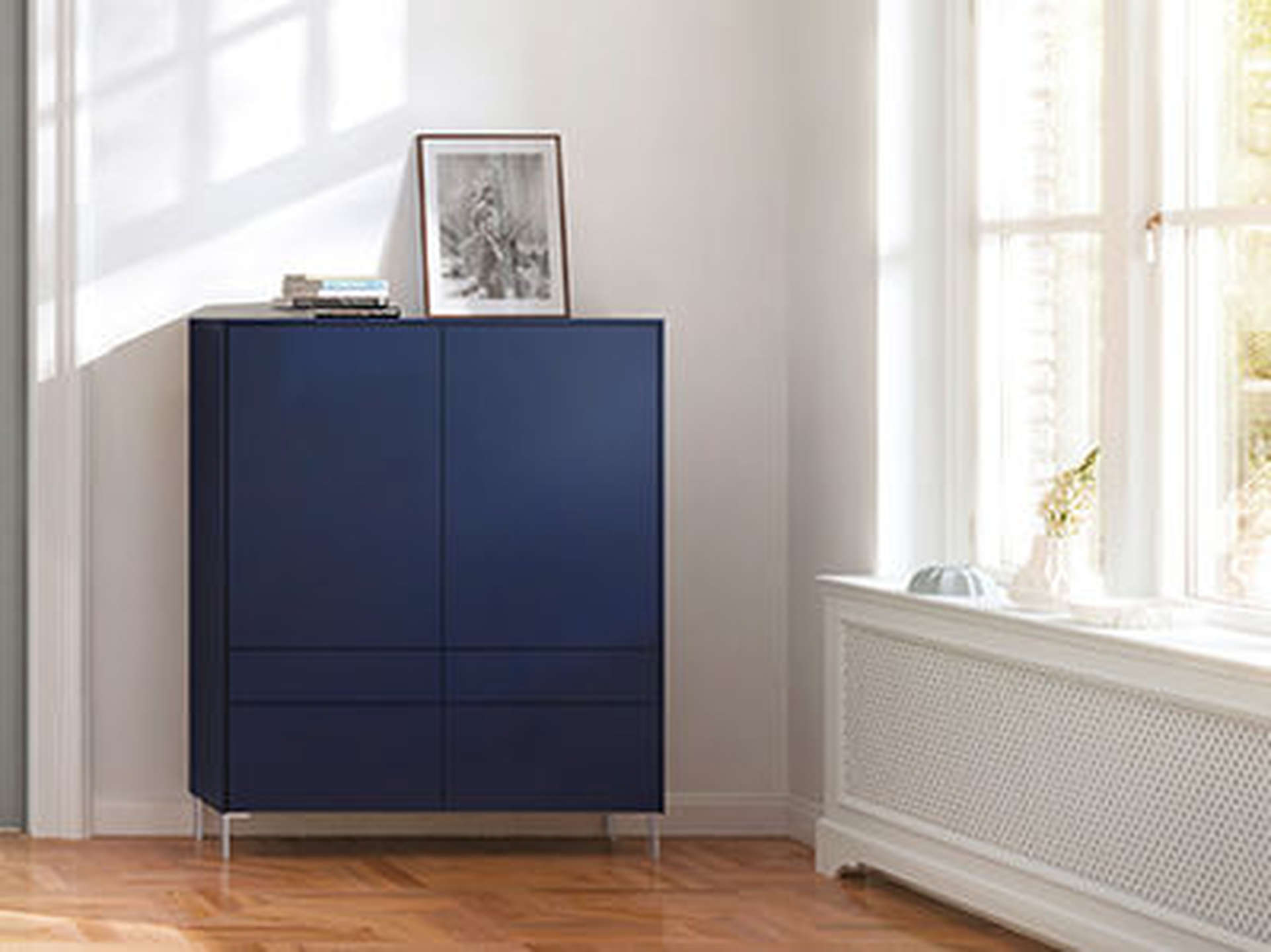 Modern interior of Lagos apartment at The Residences, featuring sleek blue cabinet