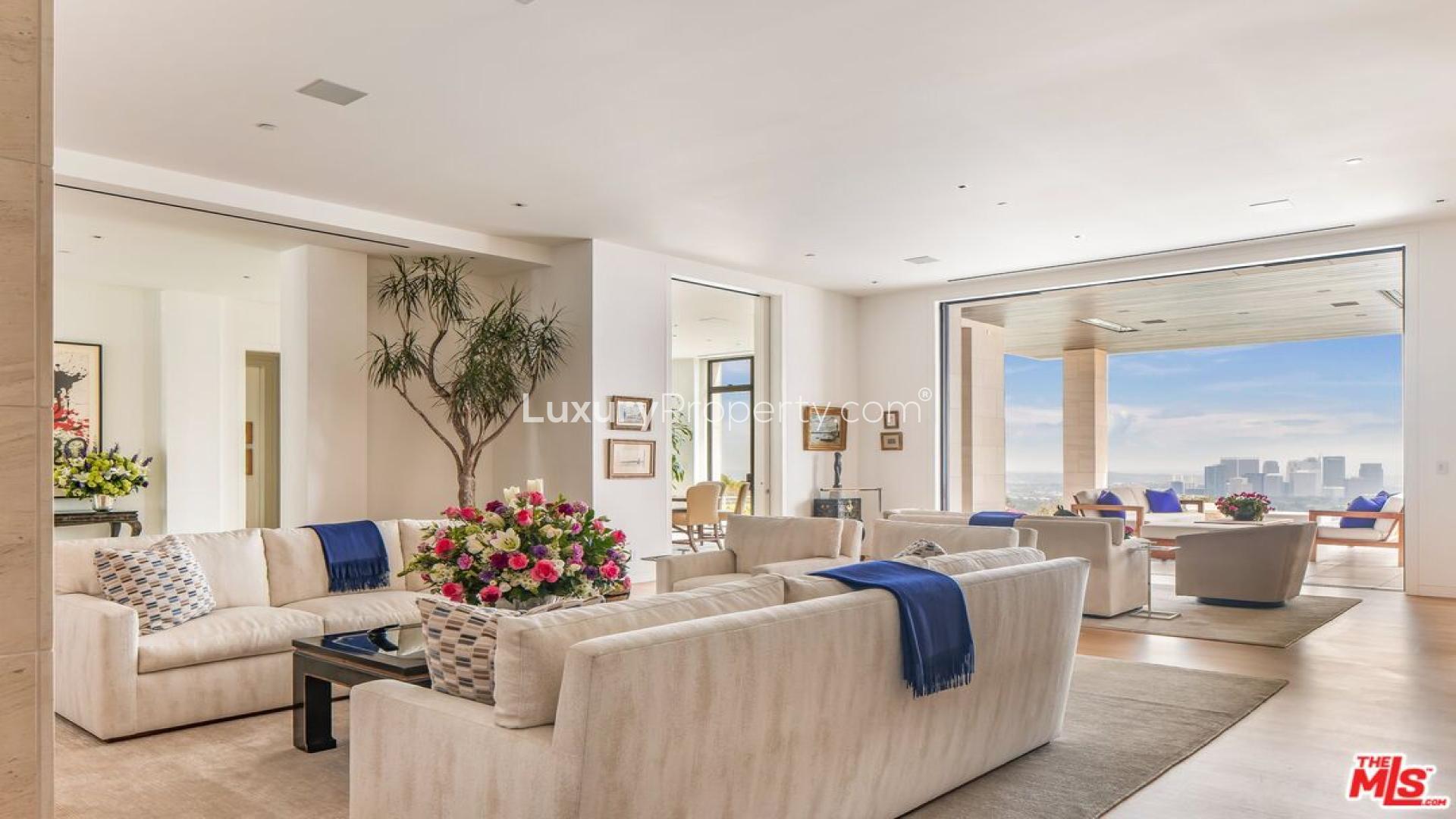 Luxurious Beverly Hills mansion with pool and stunning hillside views at dusk