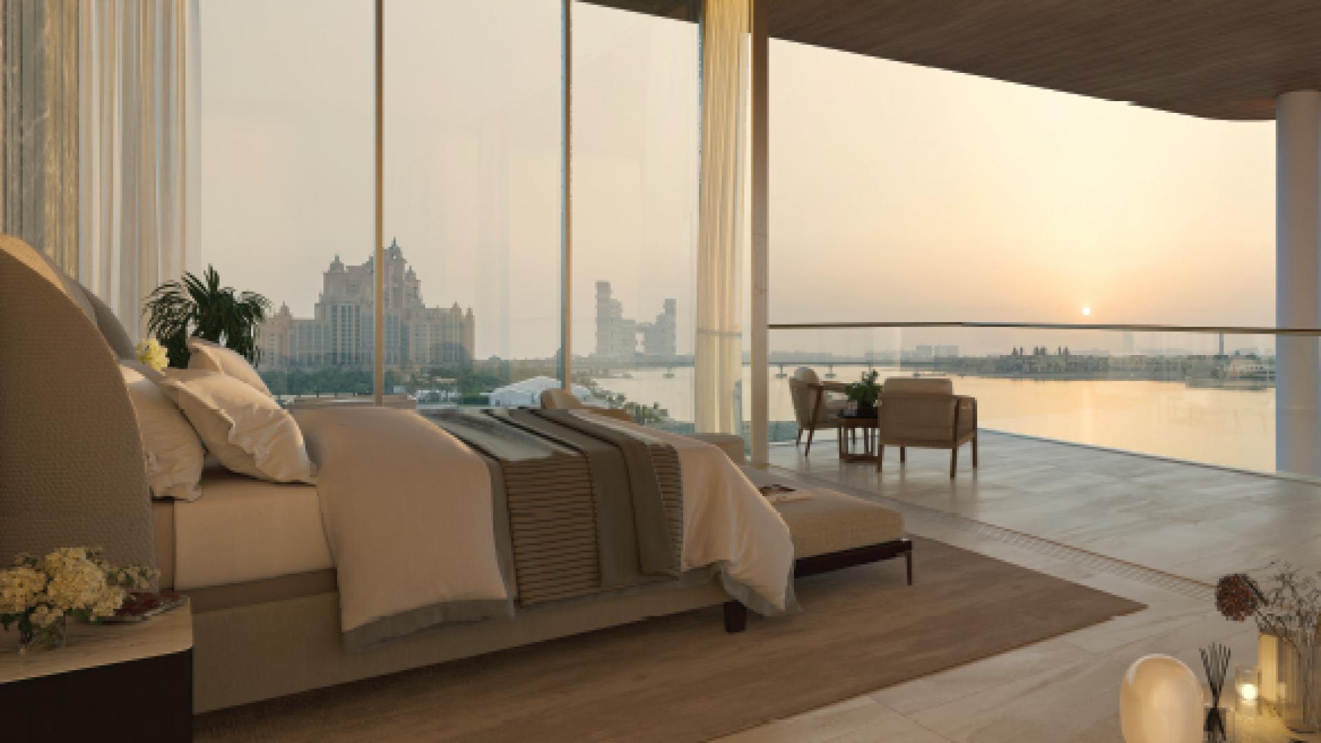 Luxurious Palm Jumeirah mansion interior with spiral staircase and ocean view at sunset