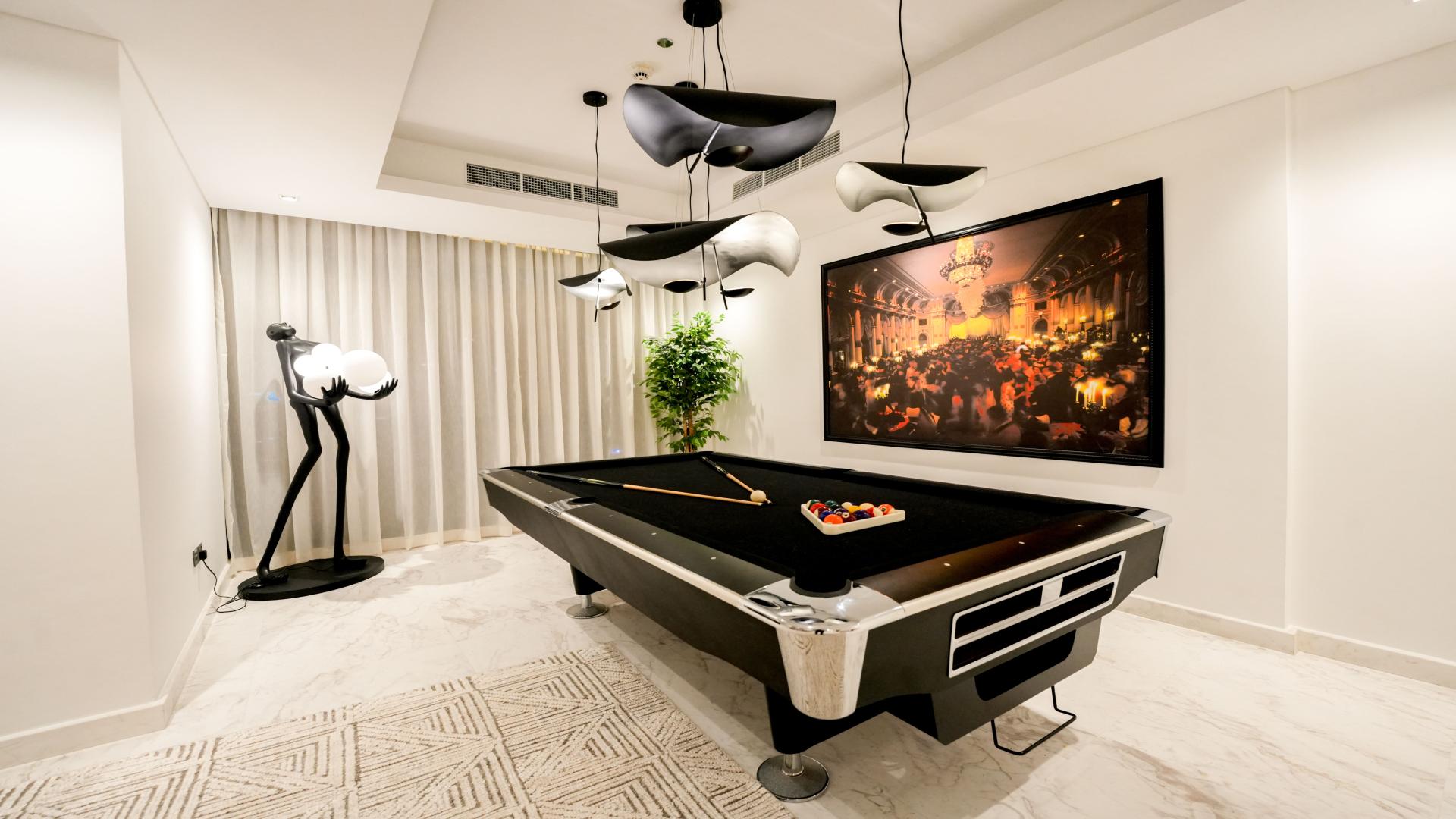 Lavish Downtown Dubai penthouse with elegant interiors, featuring a pool table and luxury decor