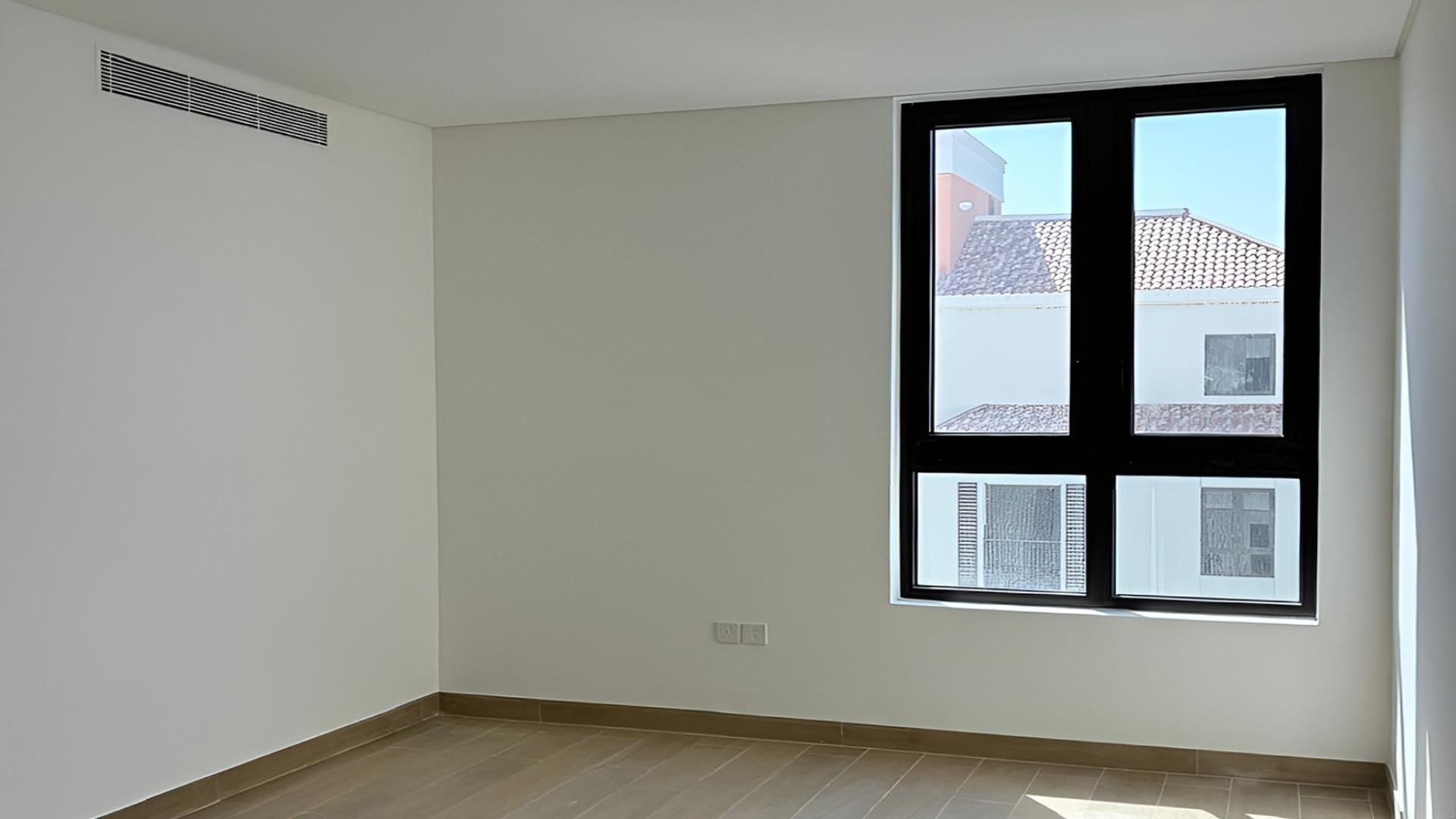 "Spacious living area in luxury 6-bedroom penthouse at La Sirene, Jumeirah for sale.",N/A,Bright hallway with large window in luxury Jumeirah penthouse for sale, La Sirene