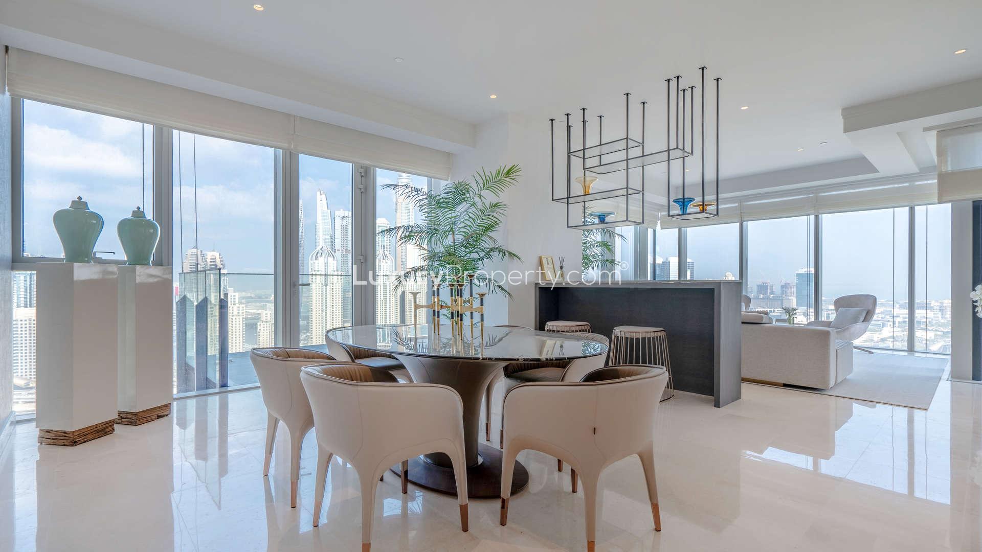 Luxurious dining and living area in JLT penthouse with stunning city views