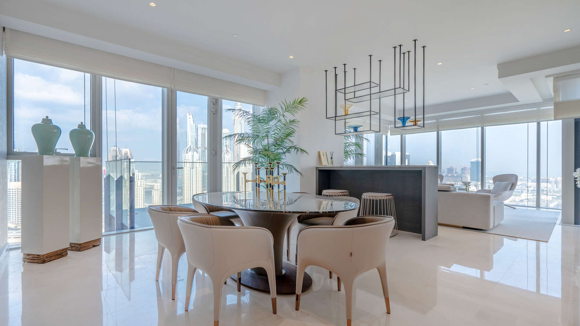 Luxurious dining and living area in JLT penthouse with stunning city views