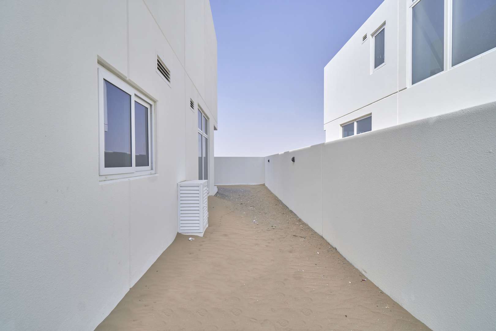 Modern kitchen in 6-bed villa, Adria Villas, Damac Hills 2, featuring sleek cabinetry and countertops