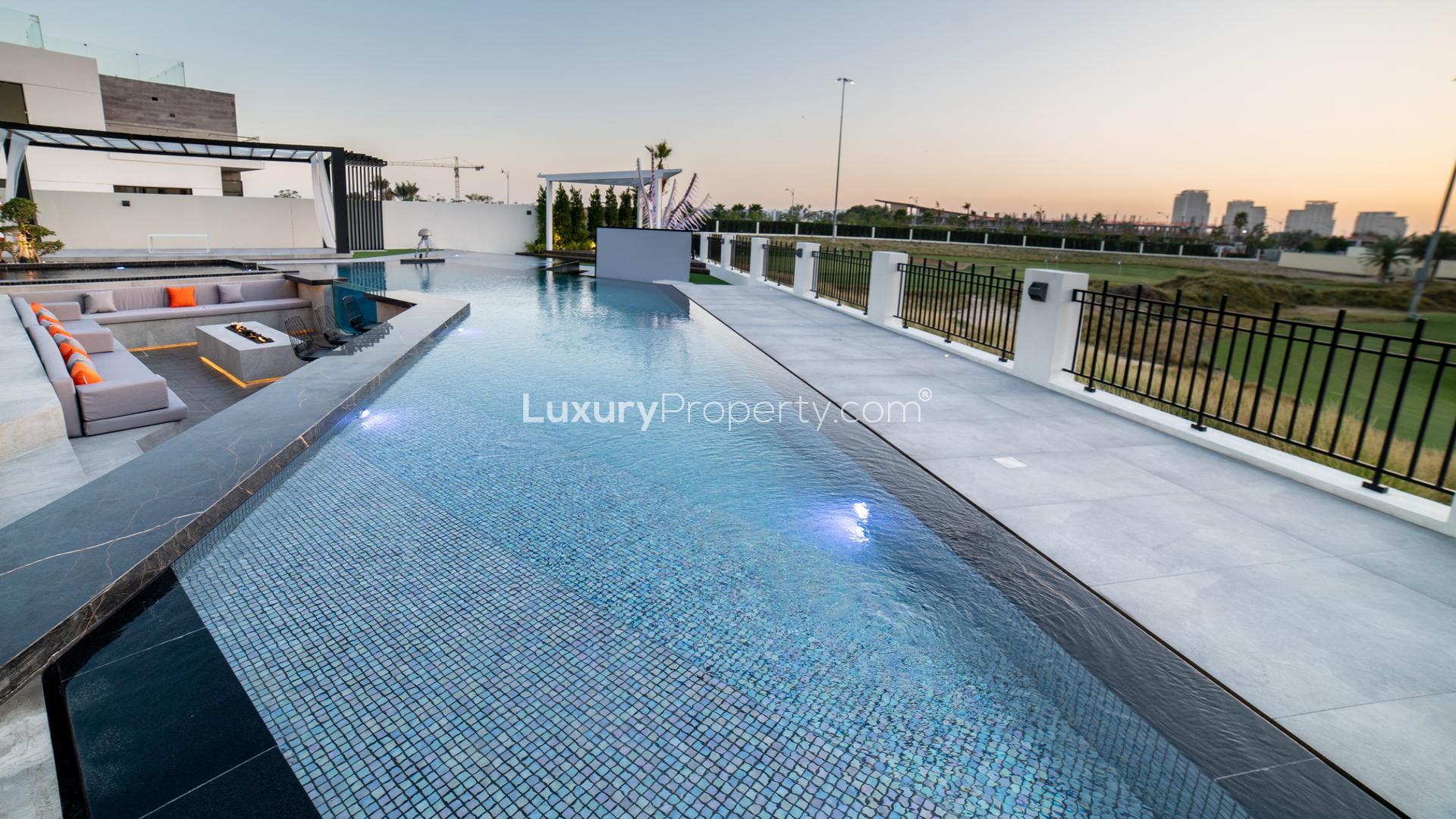 Luxurious living room in 6-bed villa, Trevi, Damac Hills, with modern decor and large windows