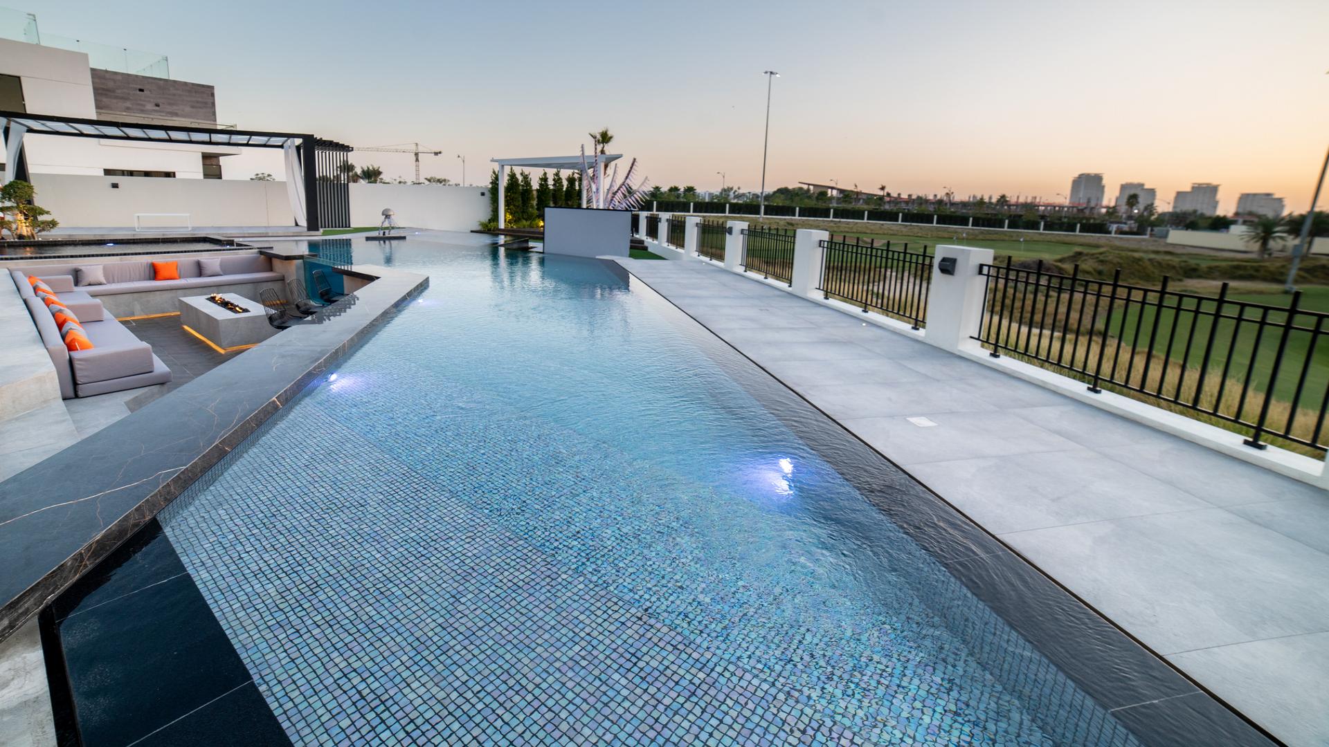 Luxurious living room in 6-bed villa, Trevi, Damac Hills, with modern decor and large windows