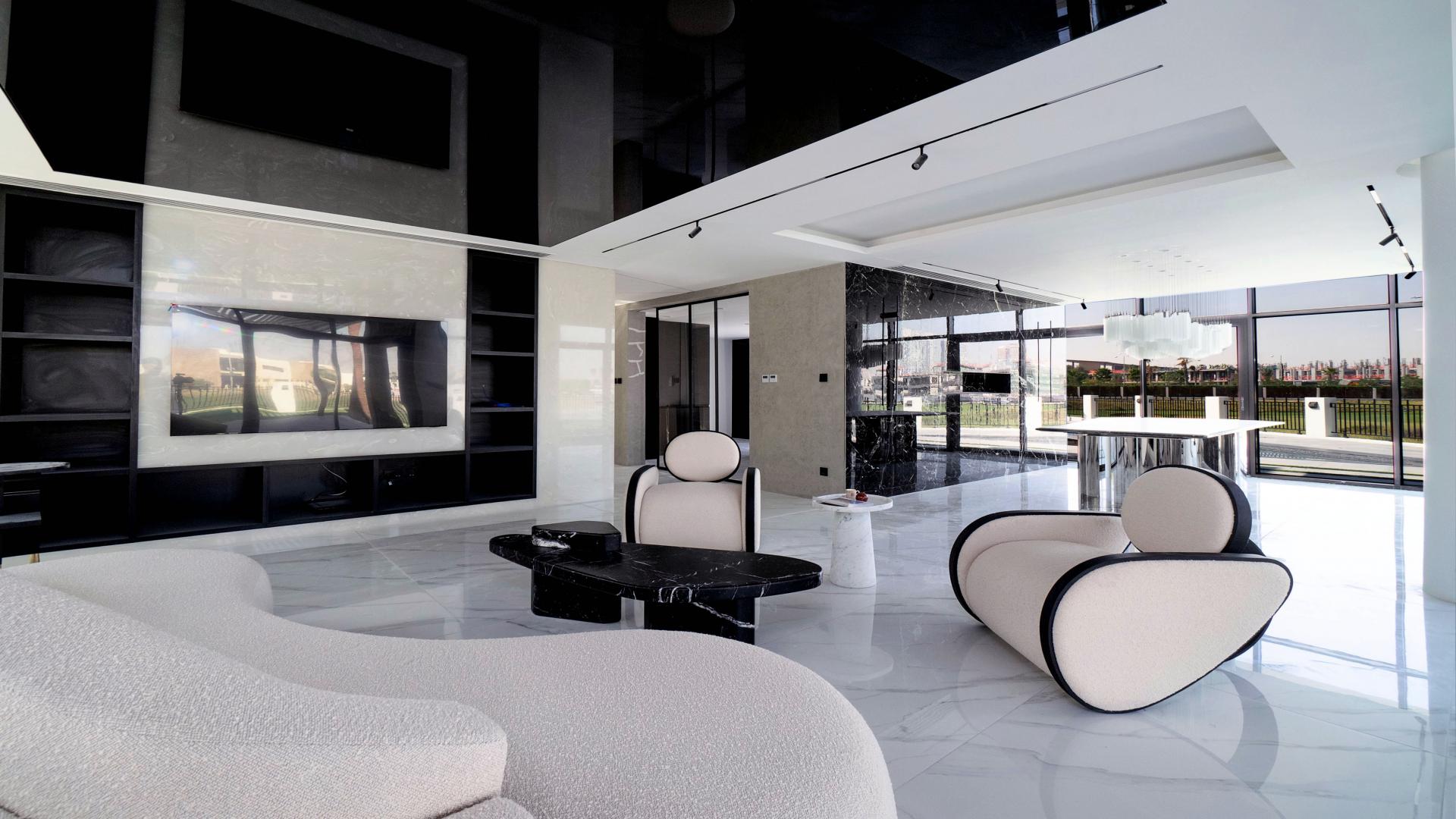 Luxurious furnished villa interior with modern decor in Damac Hills, Trevi, golf view