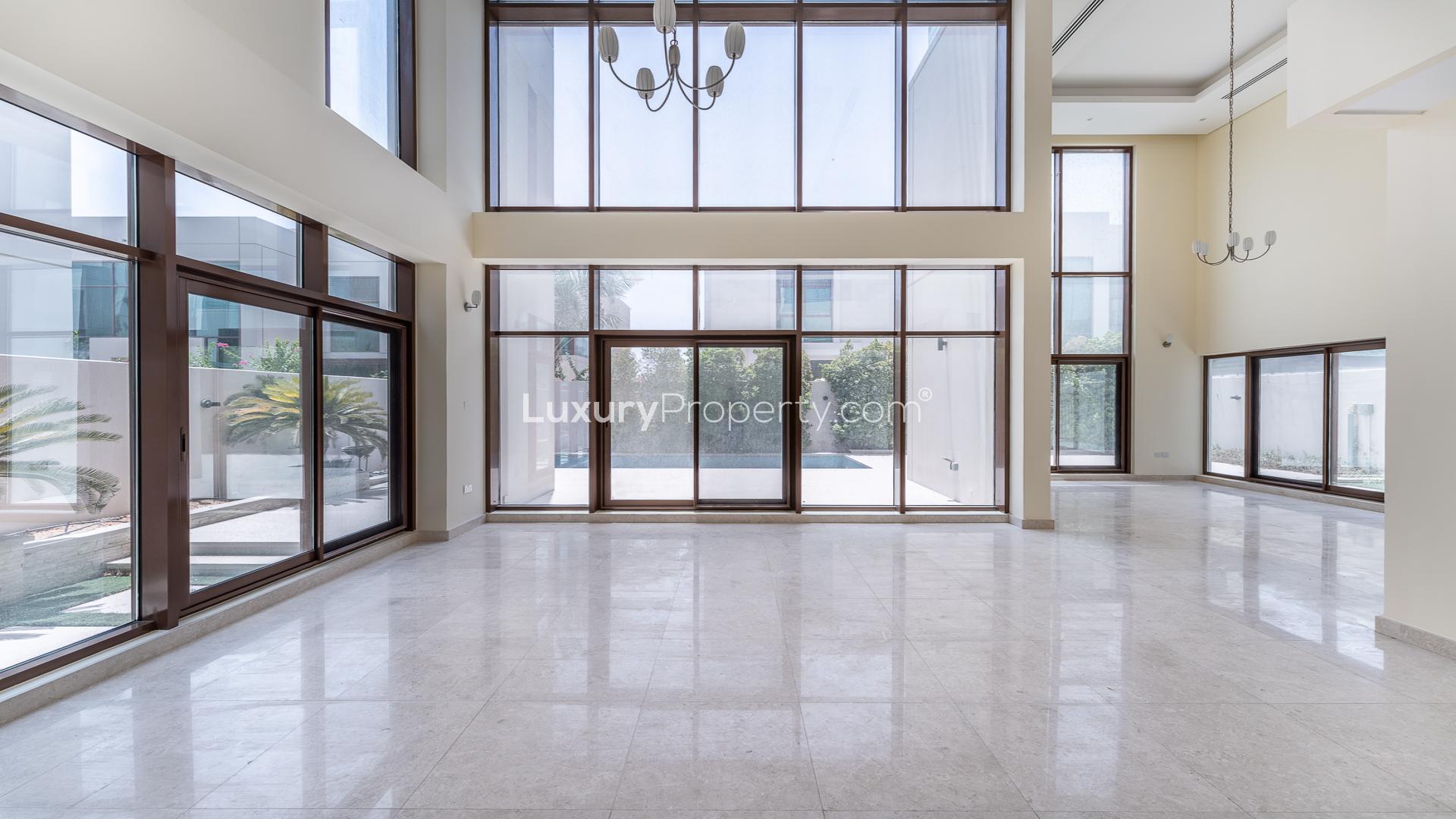 Spacious villa interior with marble floors and large windows in Meydan Gated Community