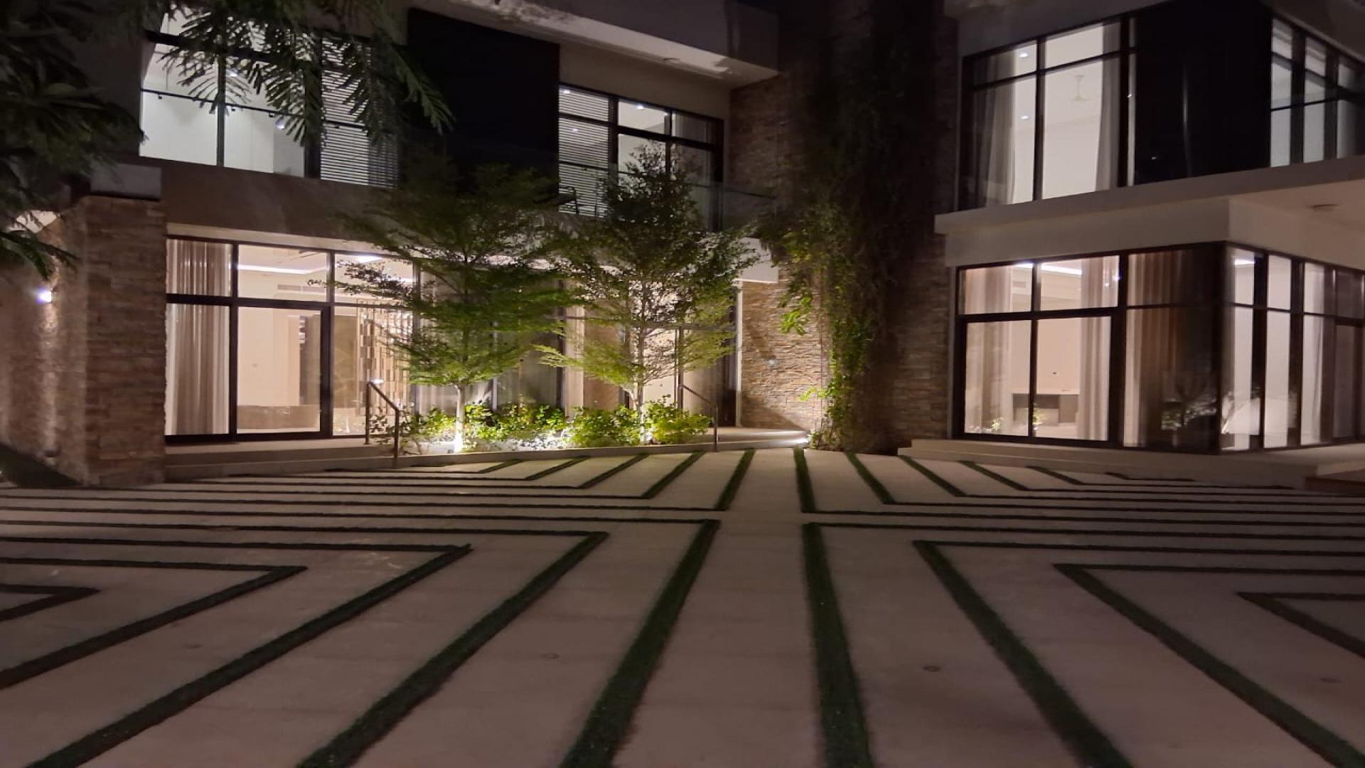 Luxury villa exterior with modern architecture in Damac Hills, Brookfield 1, golf course view