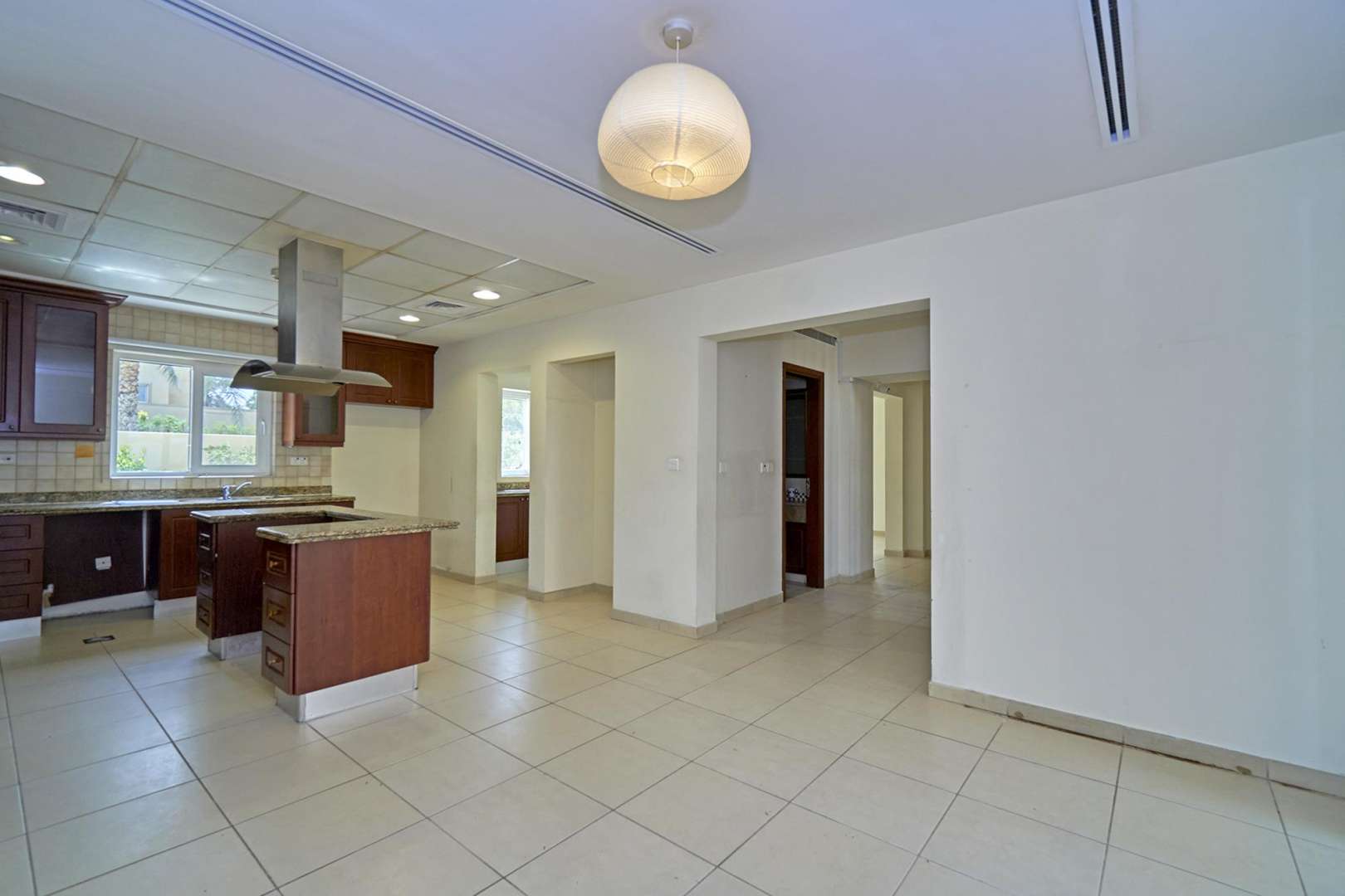 Spacious kitchen in 6-bedroom villa, Al Mahra, Arabian Ranches, with granite countertops