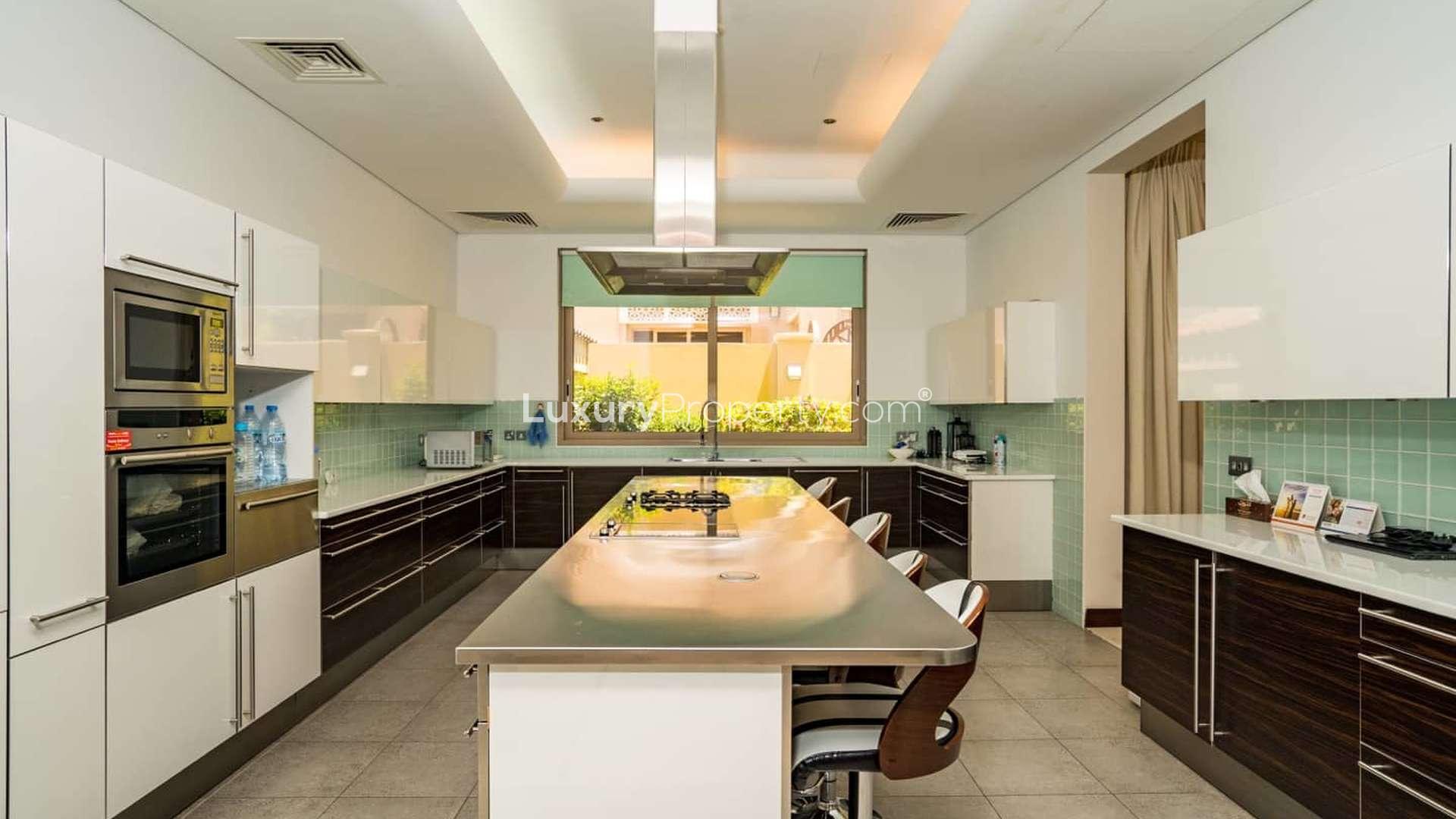 Luxurious Bromelia Villa entrance in Al Barari with elegant columns and decor