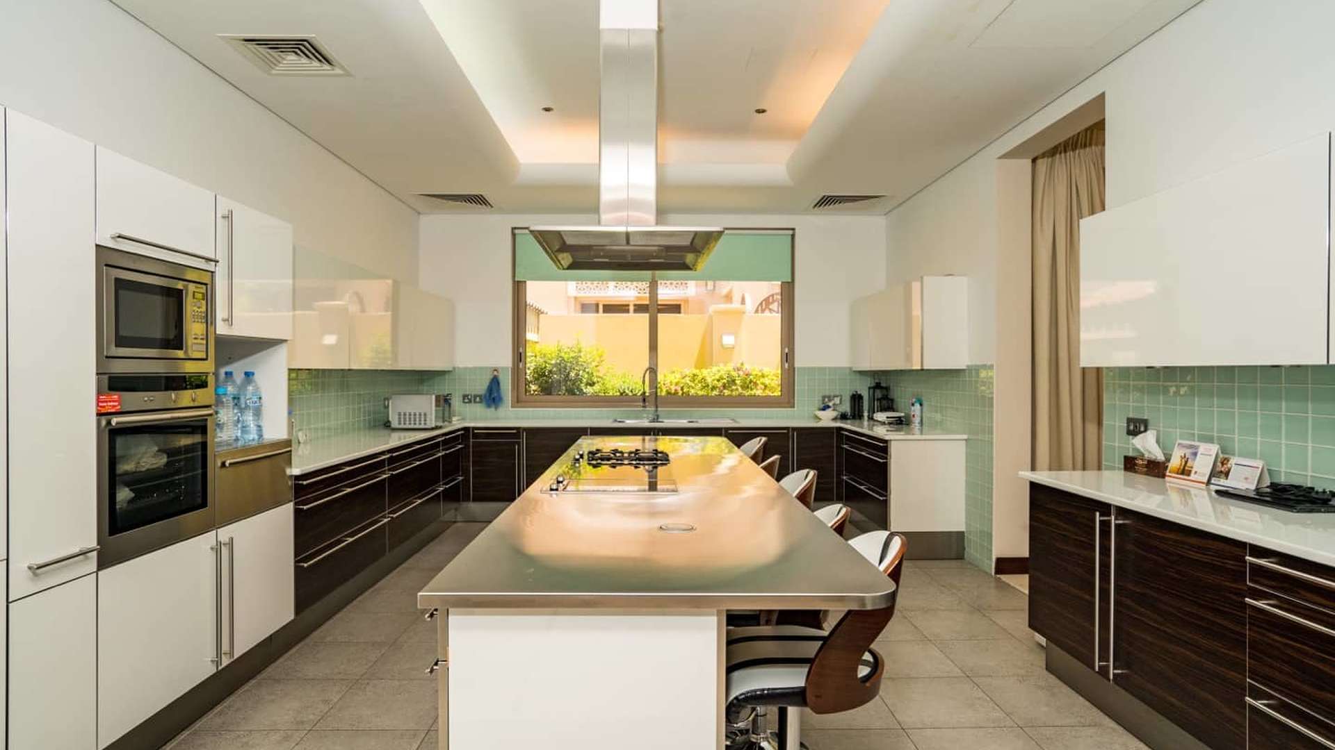 Luxurious Bromelia Villa entrance in Al Barari with elegant columns and decor