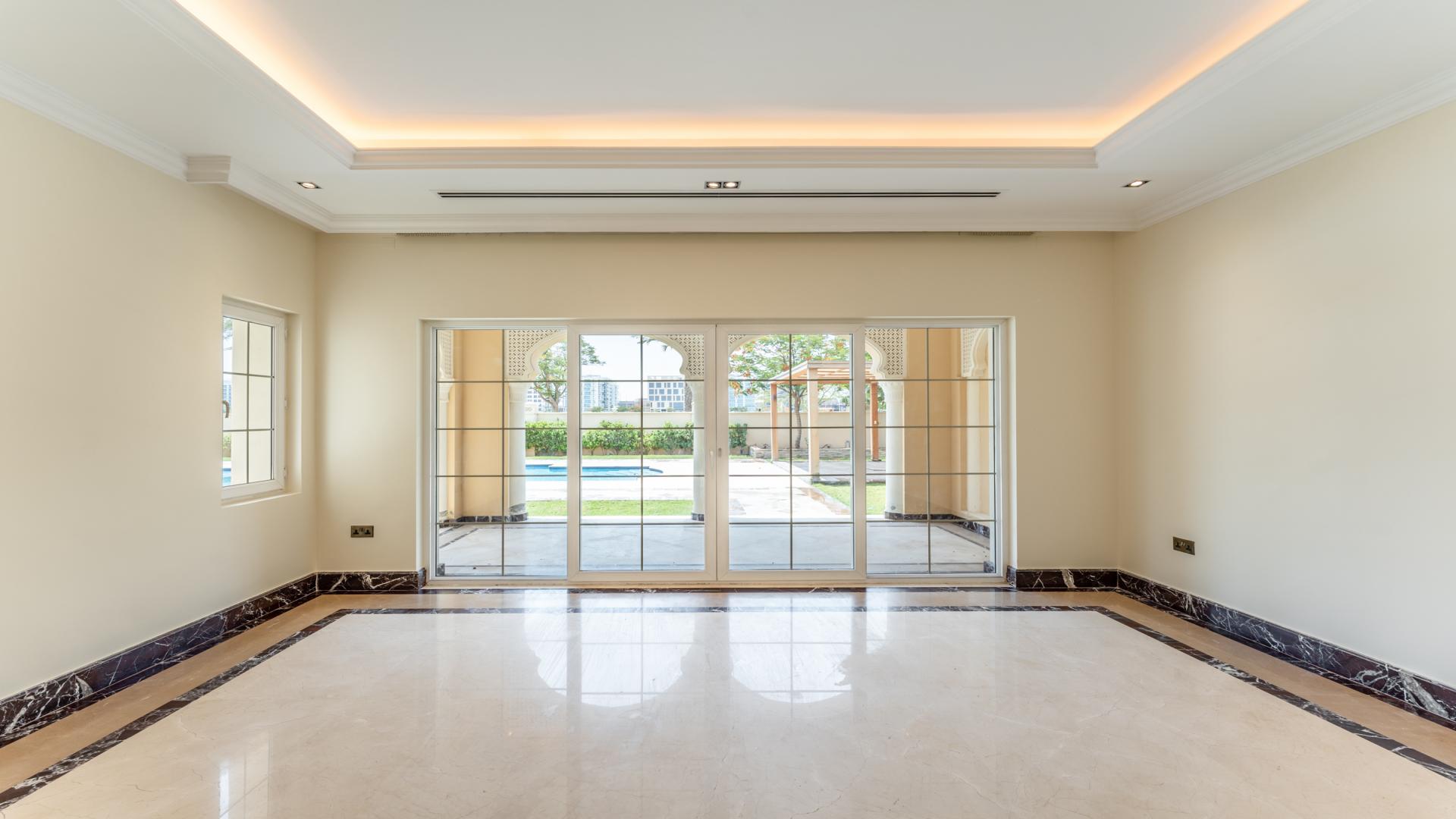 Elegant villa interior with marble floors and garden view in Polo Homes, Arabian Ranches