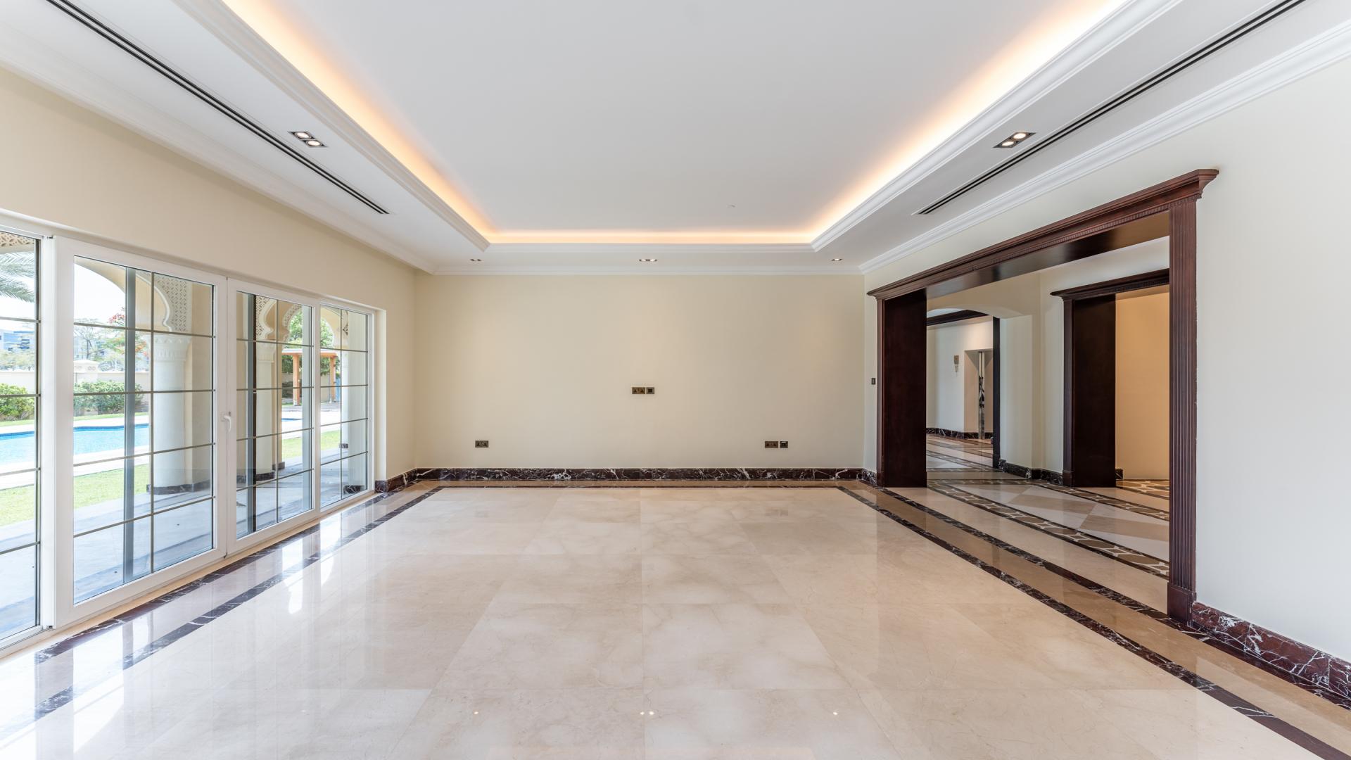 Spacious living room with marble floors in 6-bedroom villa, Polo Homes, Arabian Ranches