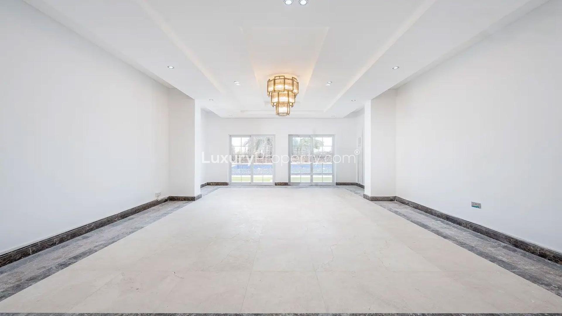 Spacious Arabian Ranches villa with pool, lush garden, and scenic views for rent