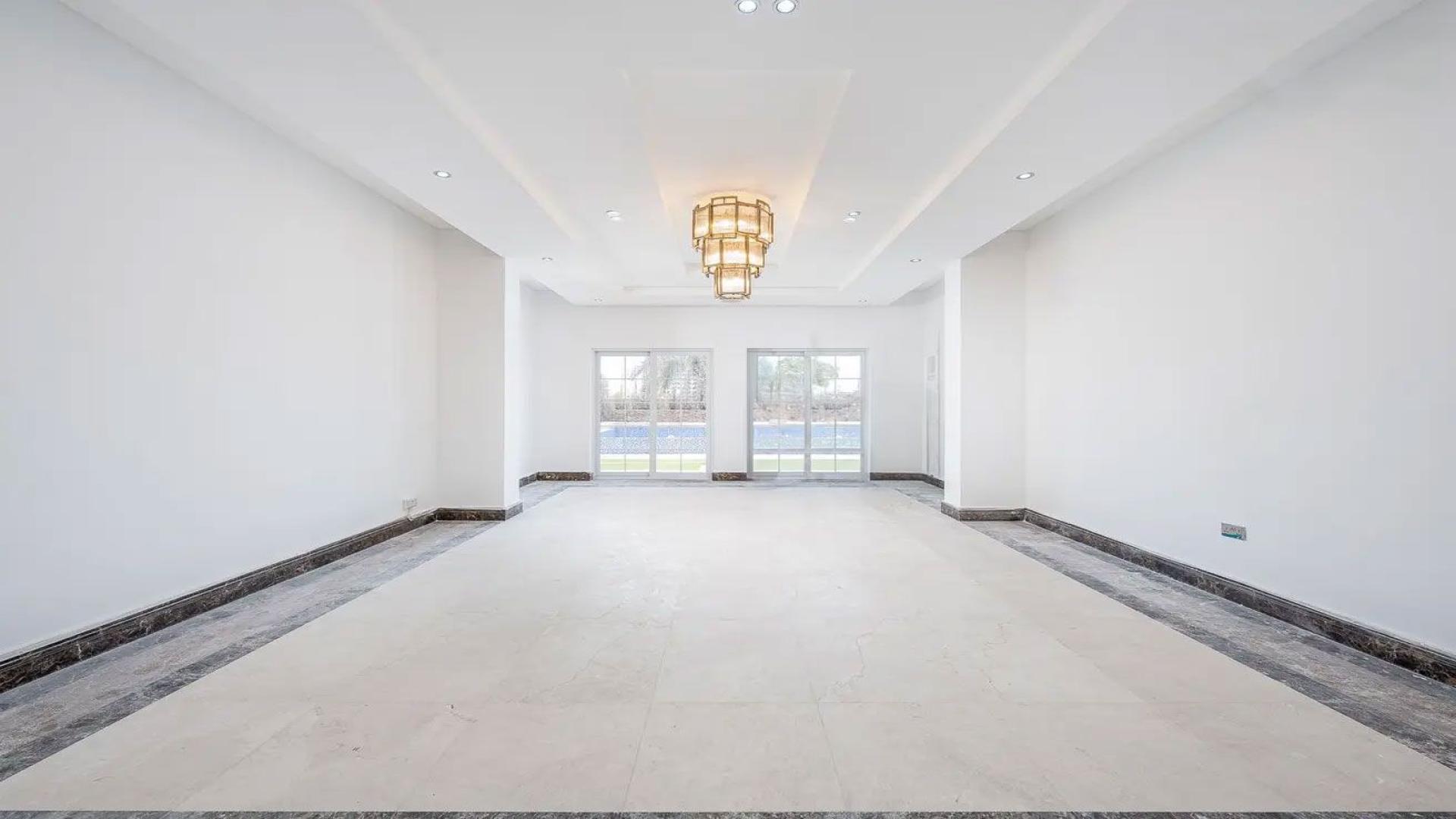 Spacious Arabian Ranches villa with pool, lush garden, and scenic views for rent