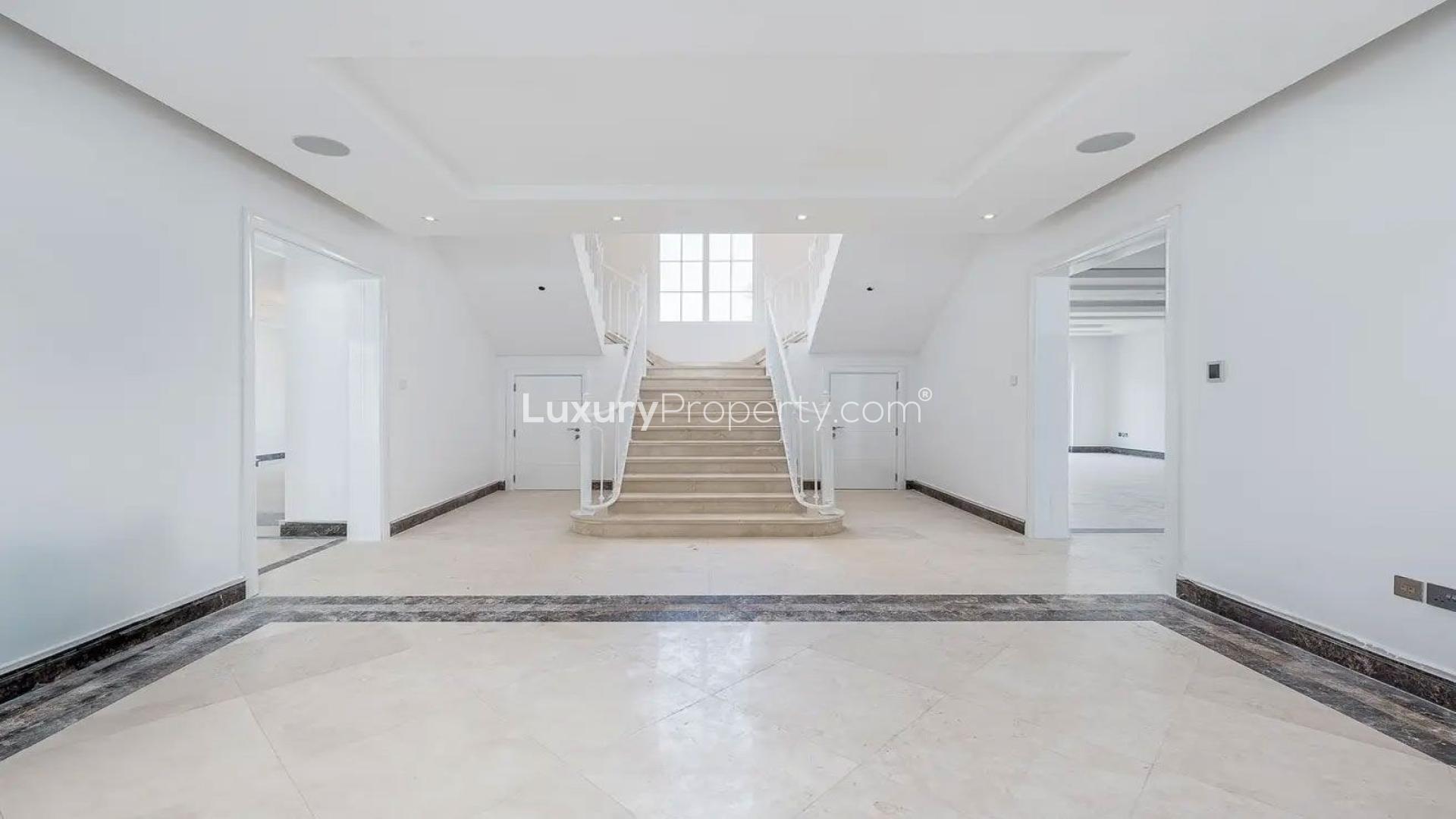 Spacious living room with modern lighting in Polo Homes villa, Arabian Ranches for rent