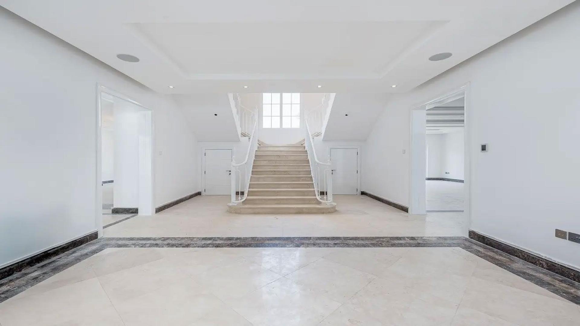 Spacious living room with modern lighting in Polo Homes villa, Arabian Ranches for rent