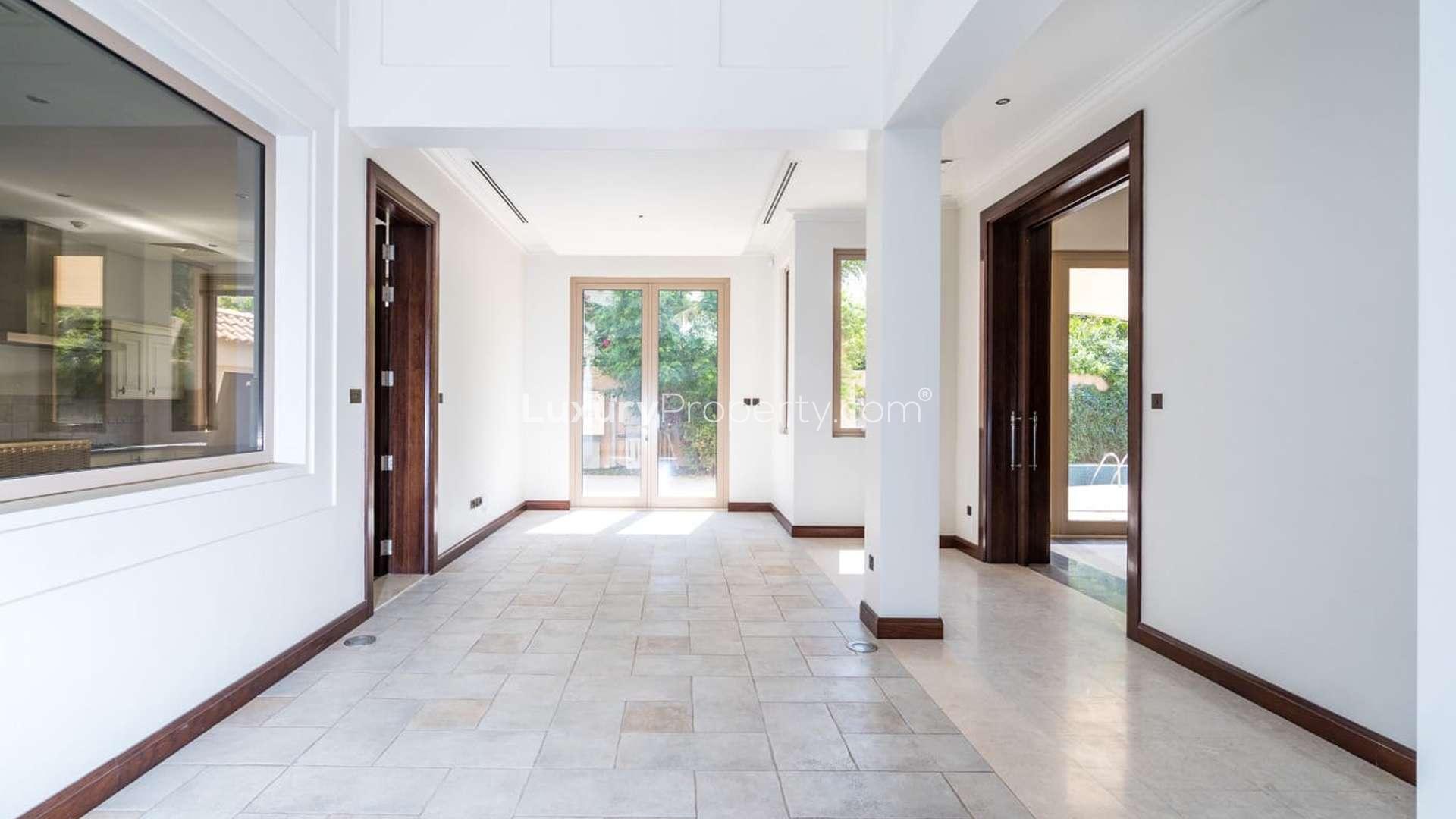 6-bedroom villa exterior with spacious driveway in Al Barari, Camellia, available for rent