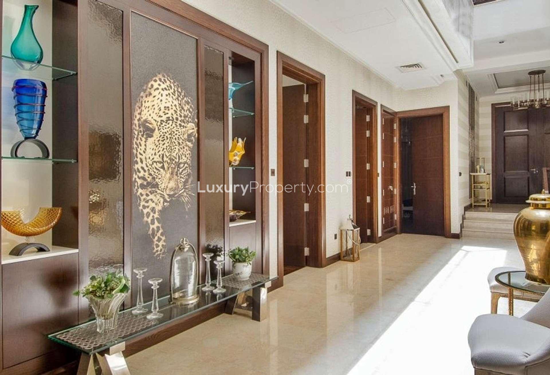 Modern kitchen in fully furnished 6-bedroom Dahlia Villa, Al Barari, with elegant countertops