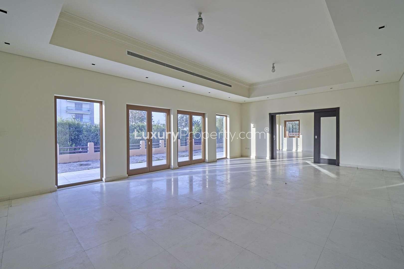 Luxurious 6-bedroom villa exterior in Al Furjan North Village, featuring three garages