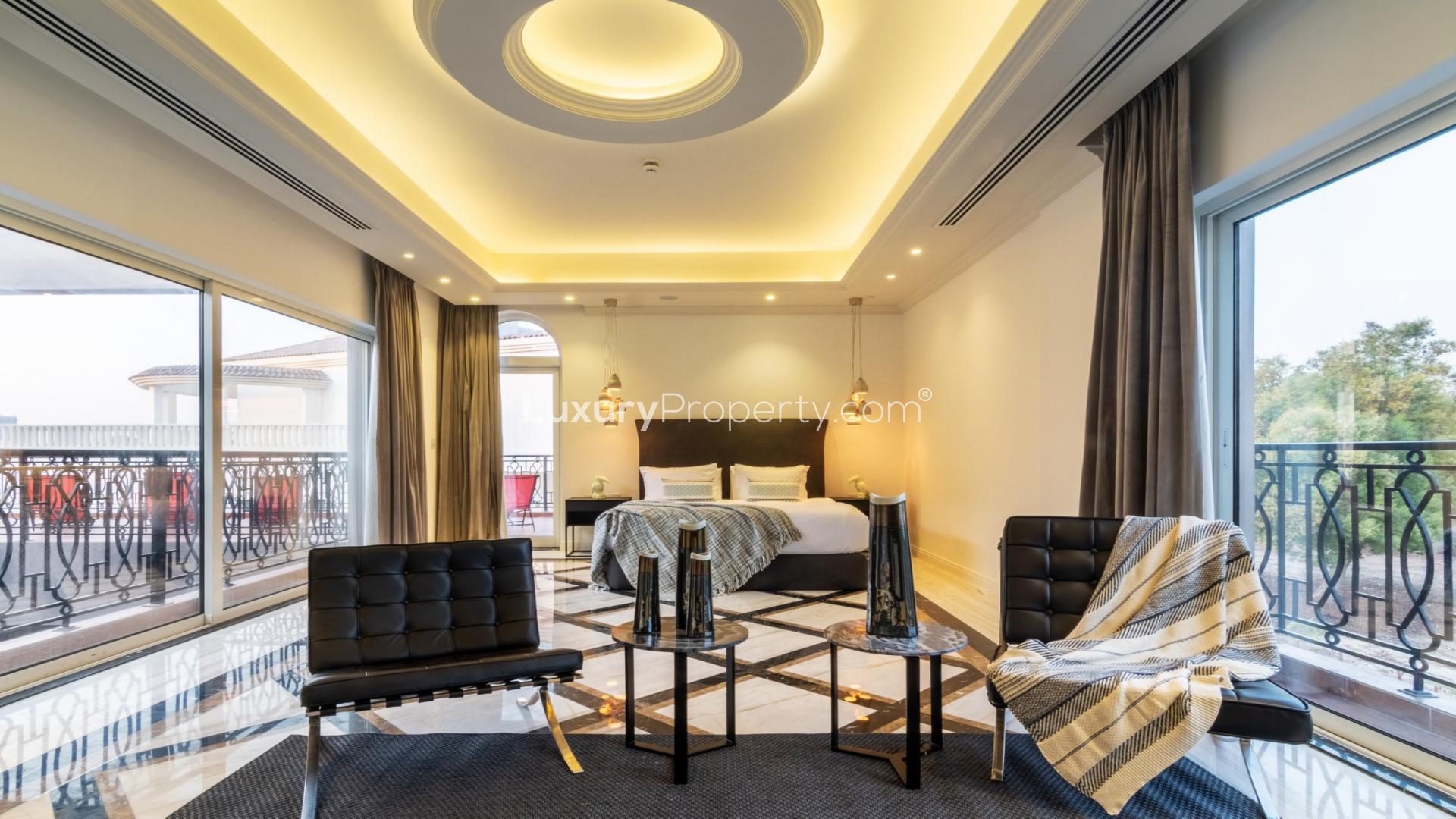 Elegant dining room in luxury villa, Jumeirah Golf Estates, Dubai. Modern chandelier and decor