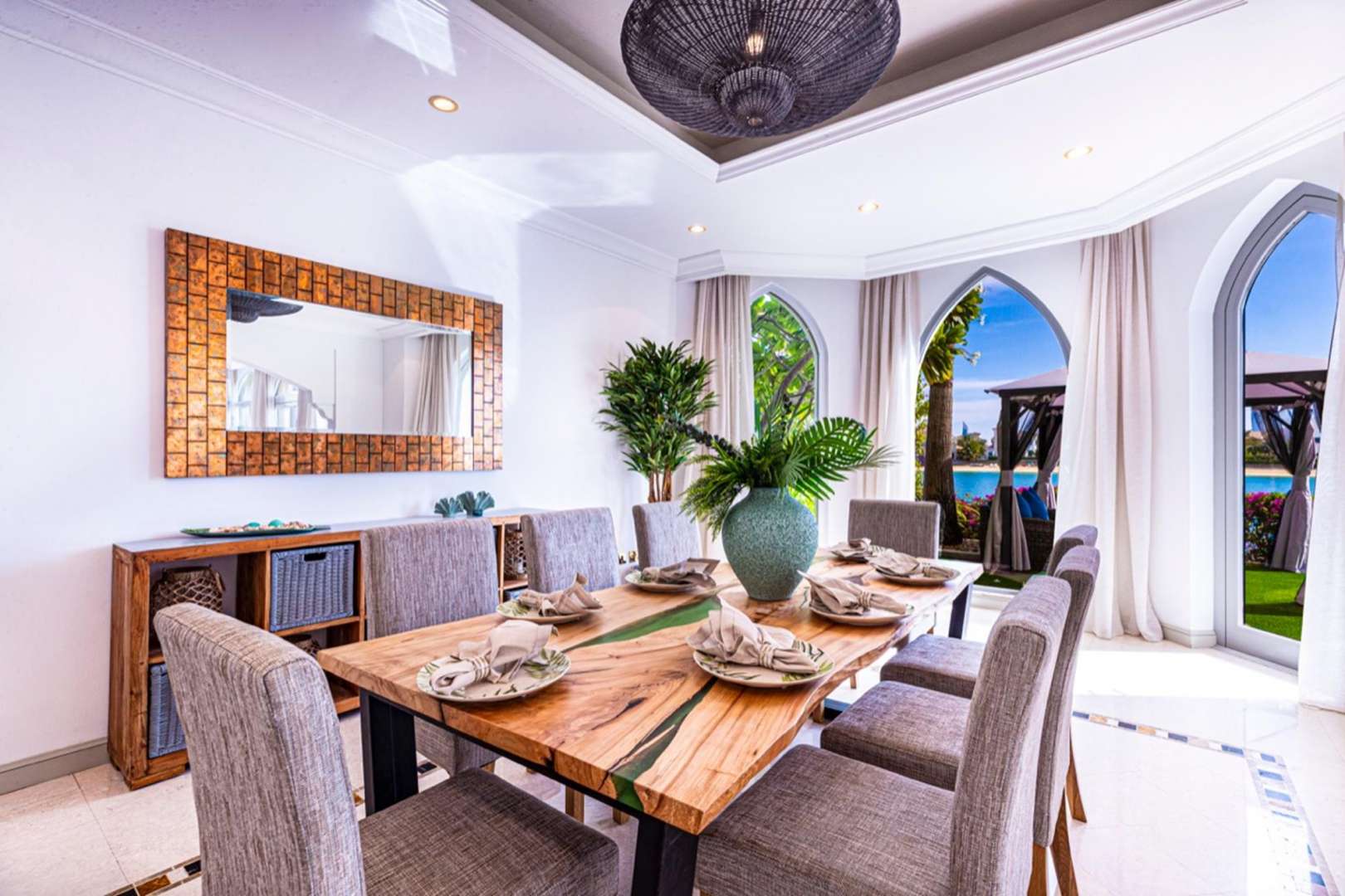 Dining room in luxurious Malibu-style villa, Palm Jumeirah, with garden and sea view