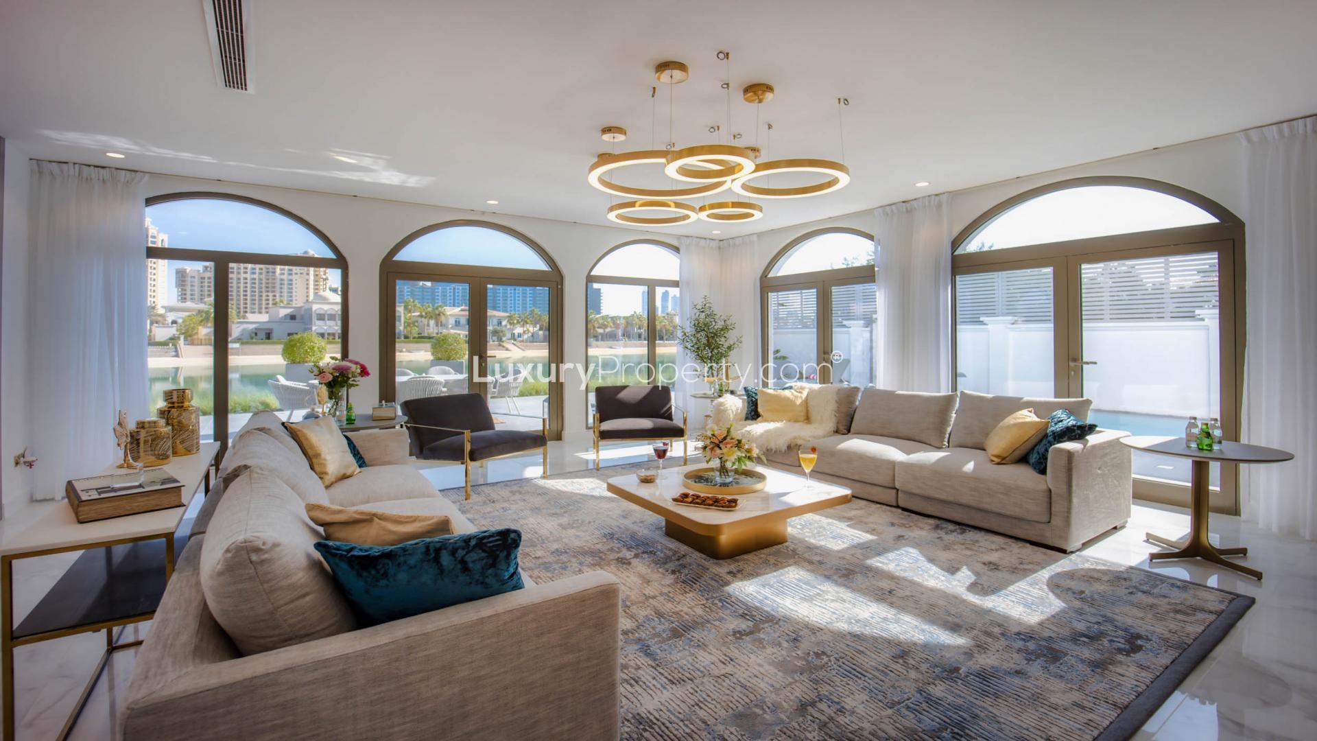 Luxurious living room in upgraded 6-bedroom villa, Palm Jumeirah, with elegant decor and marina views