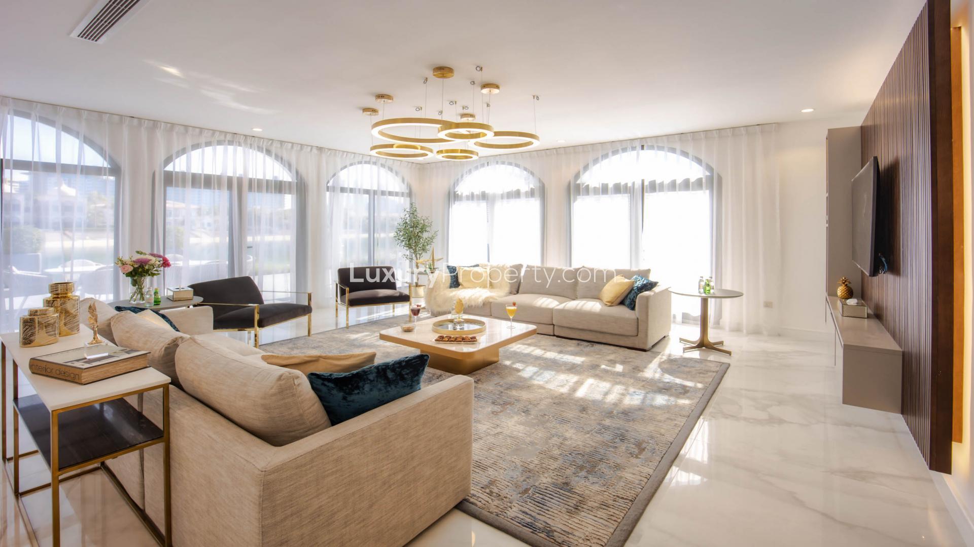 Elegant hallway in upgraded 6-bedroom villa, Palm Jumeirah, featuring modern decor and marble flooring