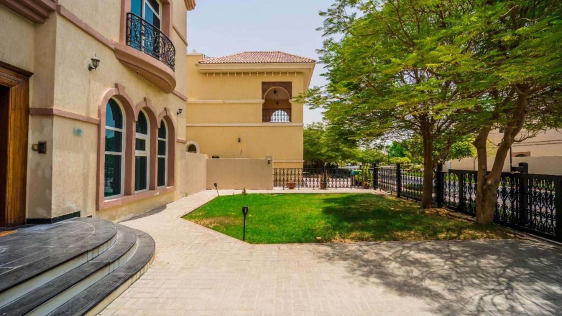 Stunning 6-bedroom villa exterior with lush greenery in Hacienda, The Villa community