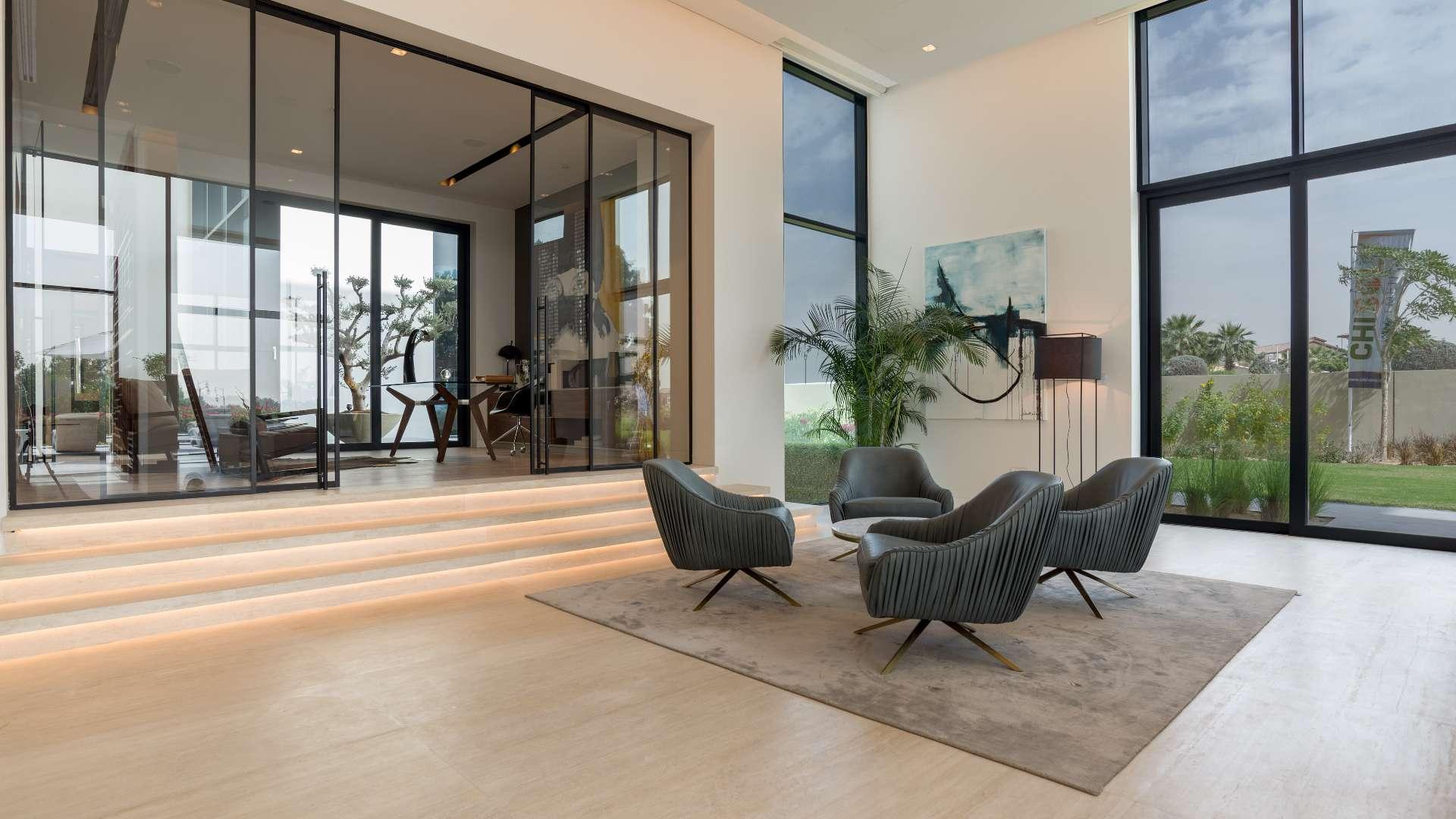 Luxurious villa interior at Hillside, Jumeirah Golf Estates with modern seating and large windows