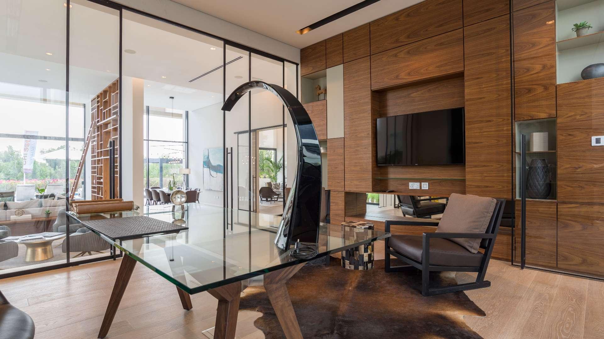 Modern interior of luxury villa in Hillside, Jumeirah Golf Estates with wooden accents