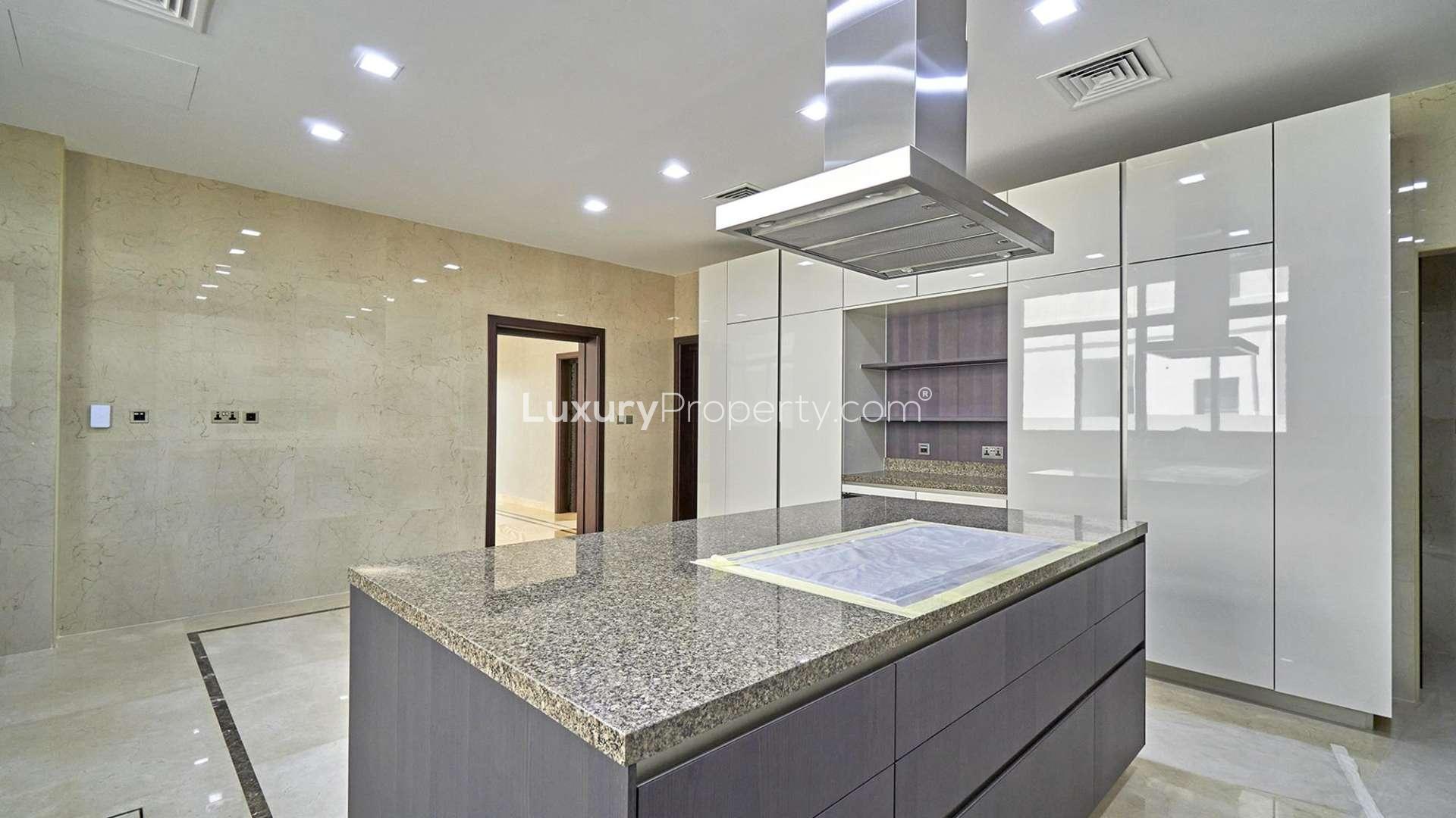 Luxurious modern kitchen in Dubai Hills Estate villa with sleek cabinetry and island