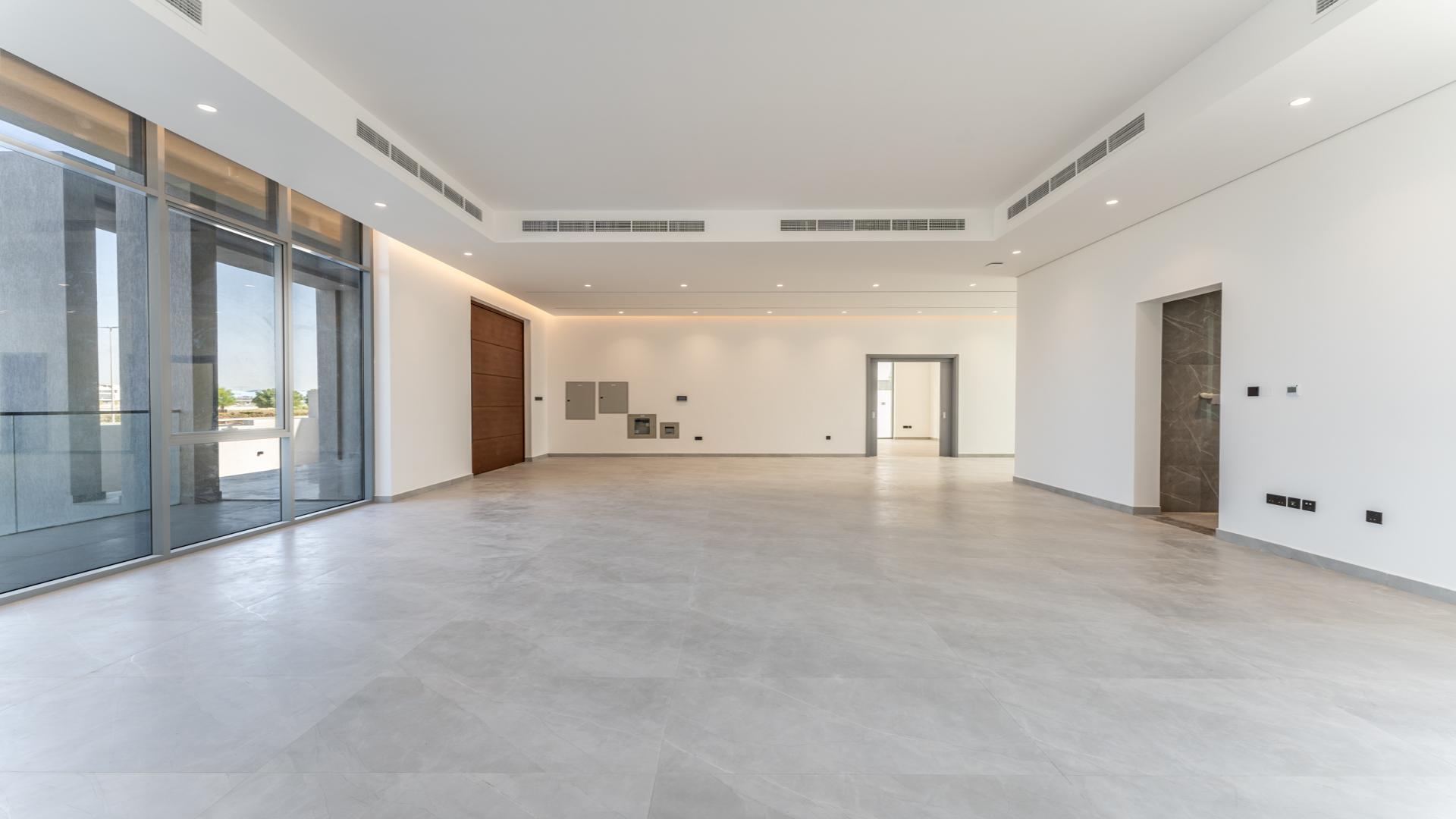 "Skyline view from brand new 6-bedroom villa in Al Barsha South 2, Dubai.",Spacious living area in brand new 6-bedroom villa, Al Barsha South 2, for rent