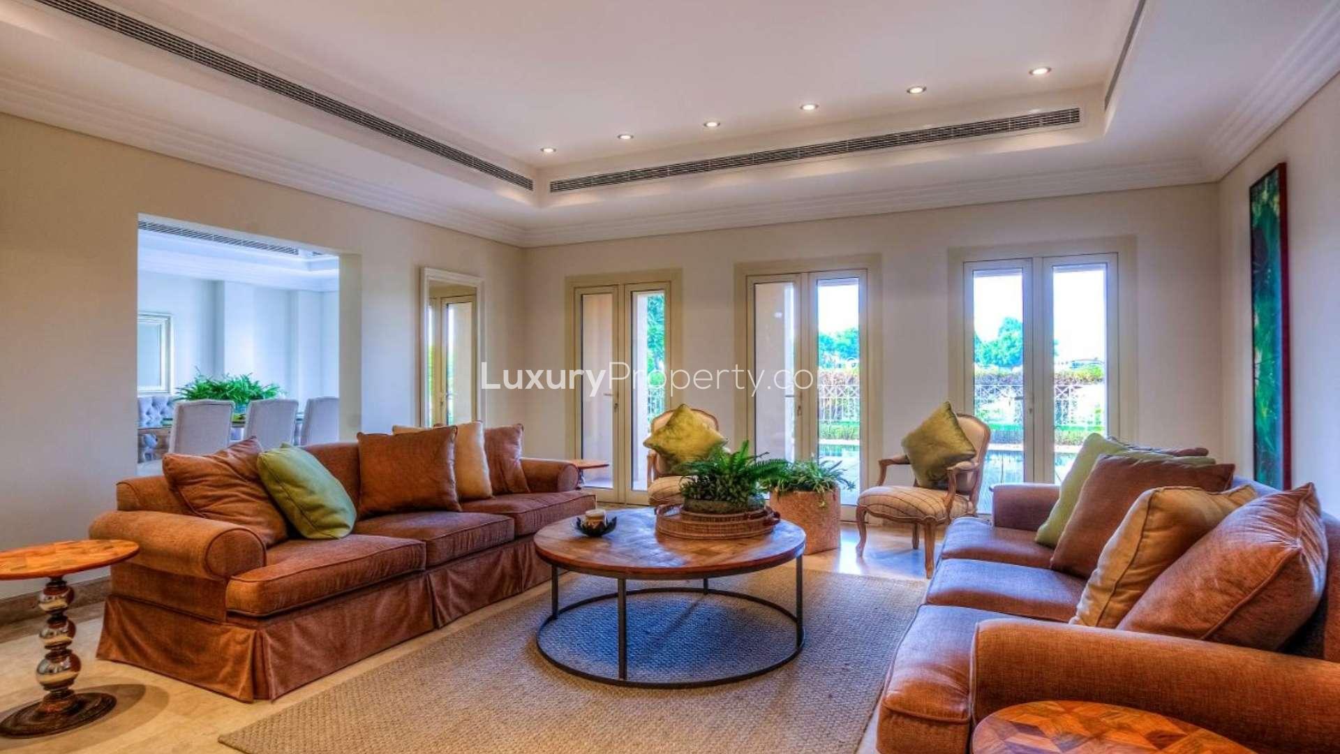 Luxurious villa exterior with covered patio in Emirates Living Meadows, available for rent