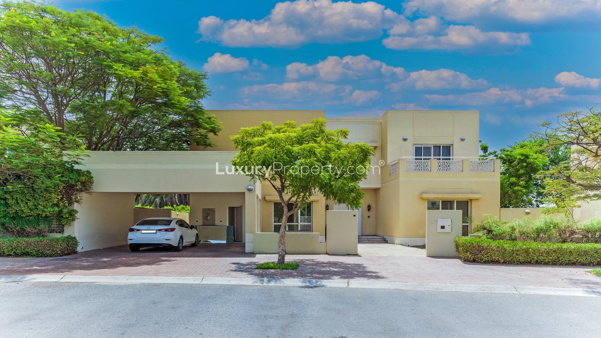 Spacious villa balcony with scenic lake and golf course views in Meadows 3 community