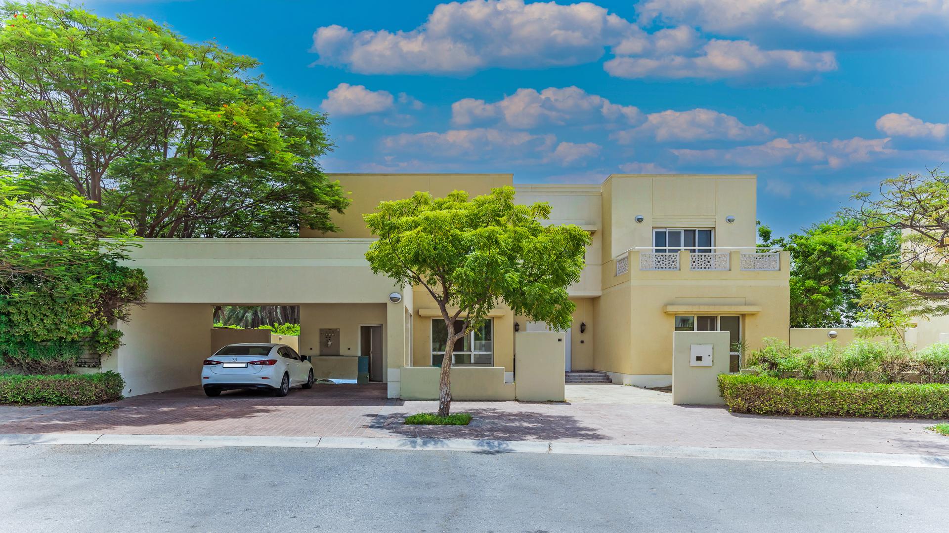 Spacious villa balcony with scenic lake and golf course views in Meadows 3 community