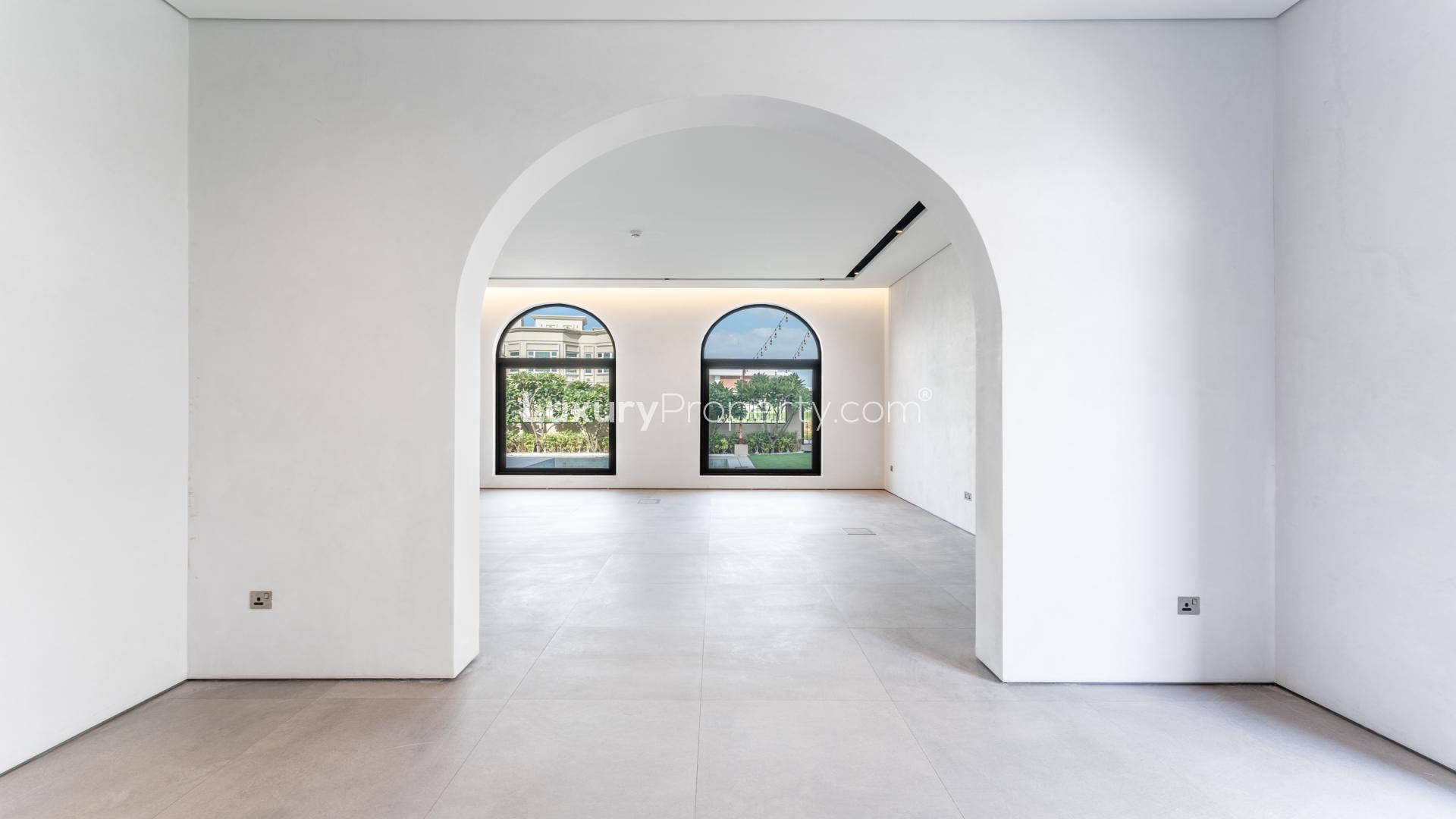 Empty room with arched windows in Colonial Spanish villa, Dubai Hills Estate