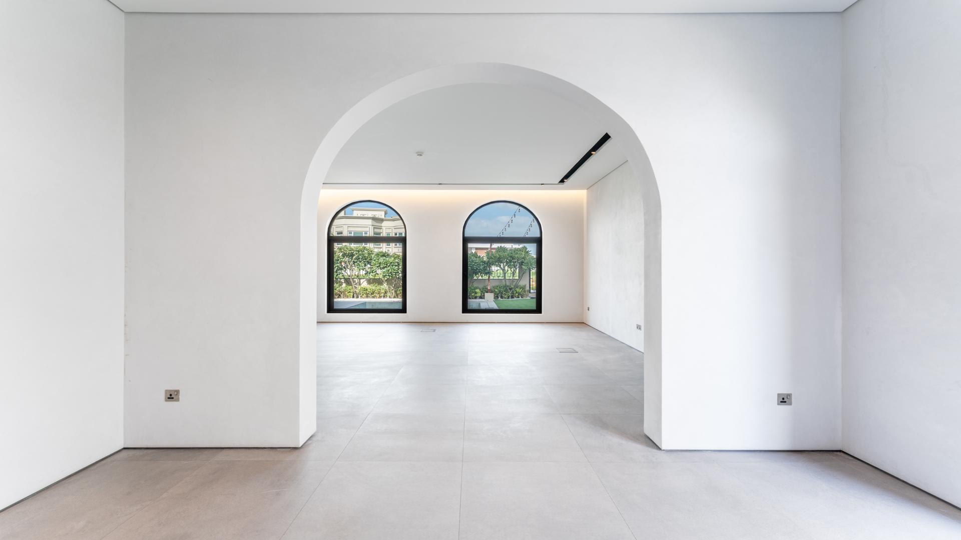Empty room with arched windows in Colonial Spanish villa, Dubai Hills Estate