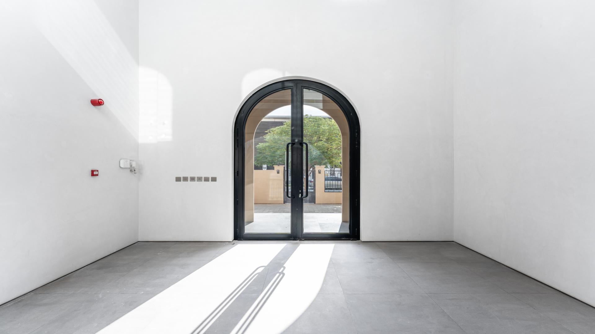 Colonial Spanish mansion interior with arched windows, Dubai Hills Estate, villa for rent