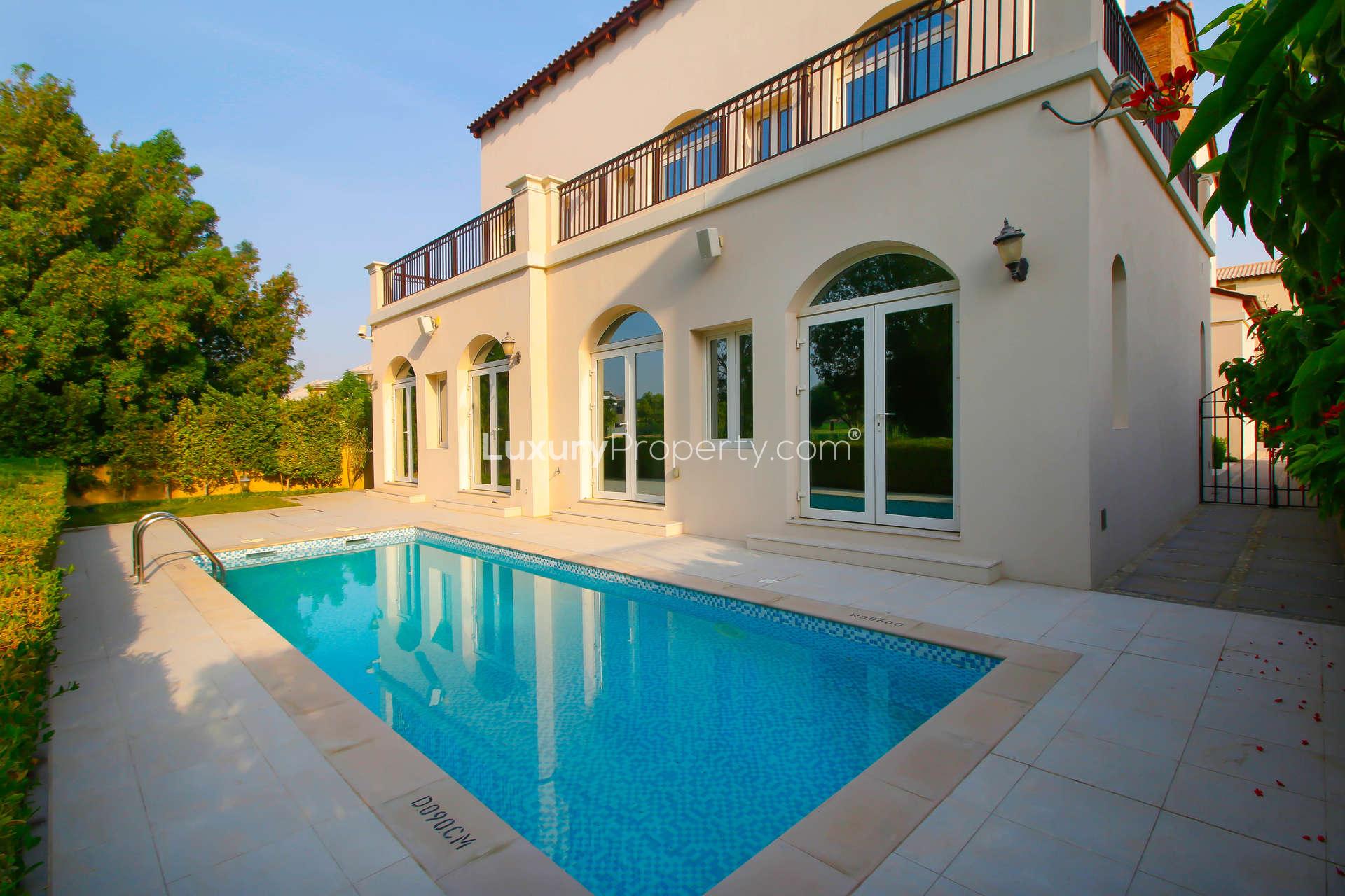 Spacious living room with large windows in Enzo Villa, Jumeirah Golf Estates for rent