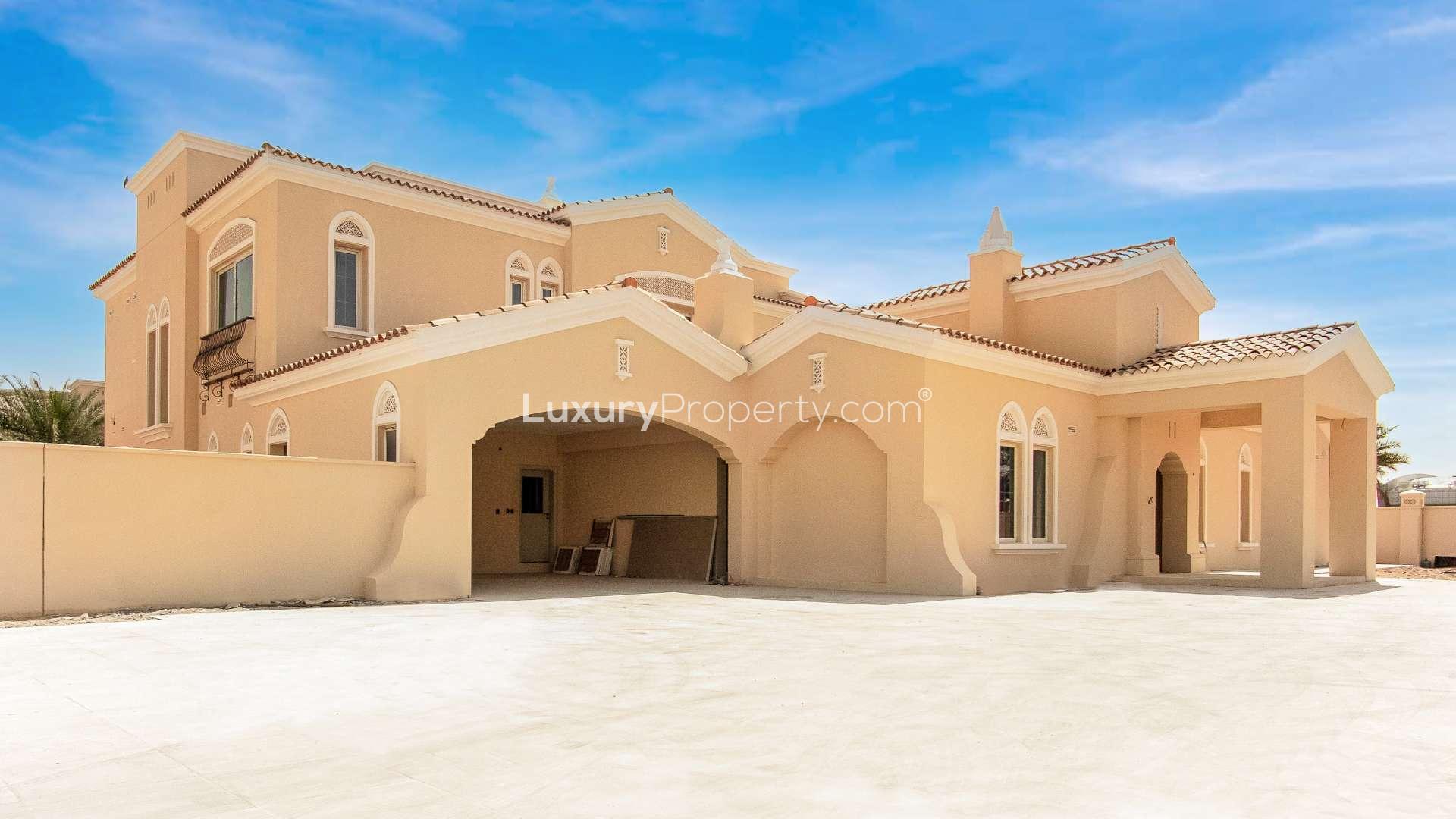 "Luxurious 6-bedroom villa with pool in Arabian Ranches, Polo Homes community for rent.",N/A,Exterior view of luxury Polo Mansion villa in Arabian Ranches, featuring elegant architecture