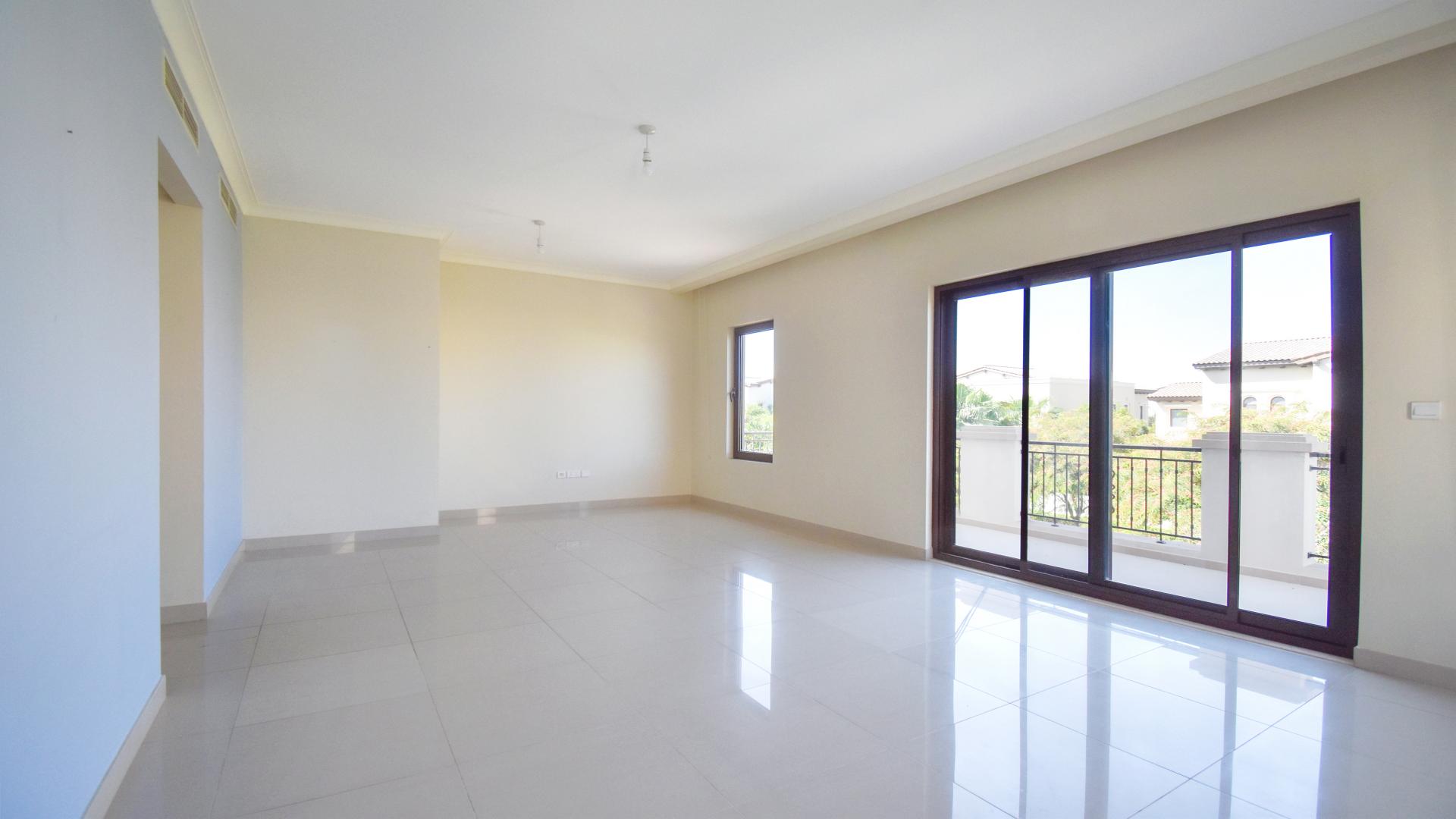 N/A,Empty living room in six-bed villa, Arabian Ranches 2, with large windows and tiled floor